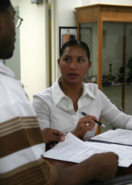 Staff Sgt. Jennifer Jankord discusses an investigation with a co-worker. Sergeant Jankord is a 446th Airlift Wing Reservist from McChord Air Force Base, Wash., who worked in the security forces investigations section while on temporary duty at Kadena Air Base, Japan.