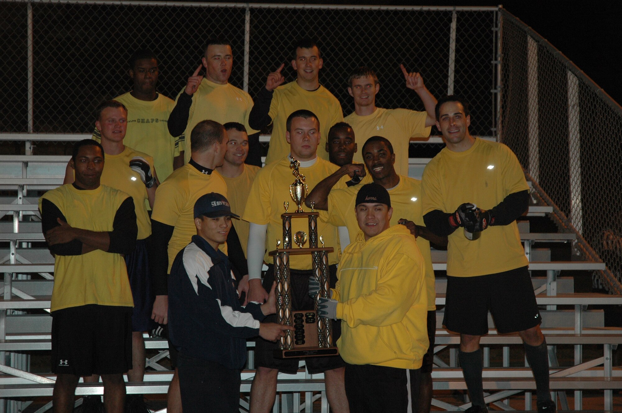 325th Medical Group flag football team poses with the base trophy after beating the 325th Operations Support Squadron team in the championship game Tuesday night.  The 325th MDG was the sixth seeded team in the playoffs. (U.S. Air Force photo/ Airman 1st Class Anthony J. Hyatt)