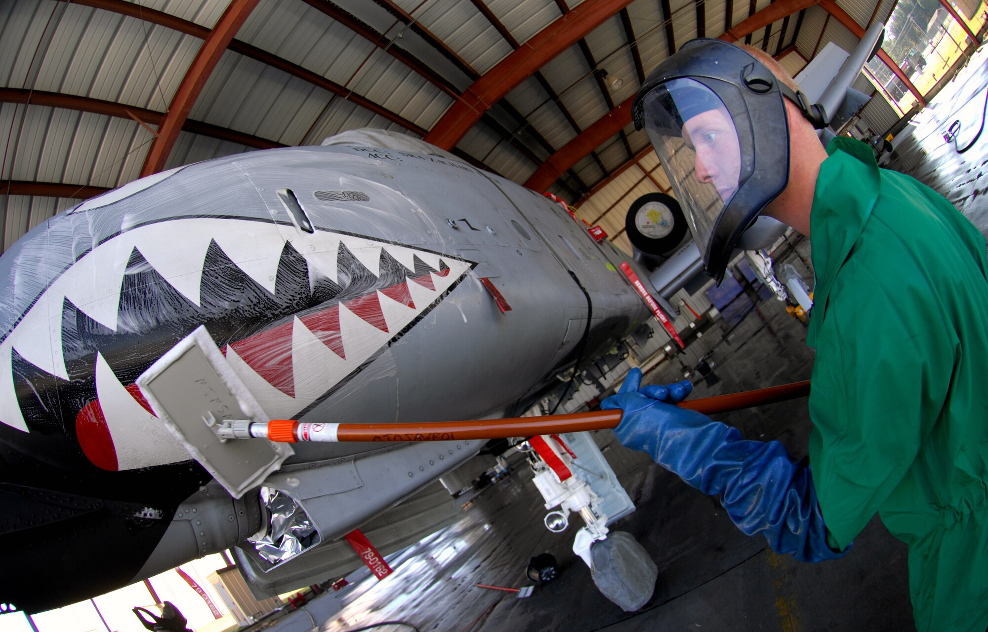 Airman 1st Class Joshua Norris washes an A-10 Thunderbolt II Nov.19 at the corrosion control wash rack at Moody Air Force Base, Ga. The A-10 receives a thorough wash-down and lubrication every three months to prevent corrosion and to inspect for surface damage. Airman Norris is a 23rd Aircraft Maintenance Squadron A-10 crew chief.  (U.S. Air Force photo/Senior Airman Angelita Lawrence) 
