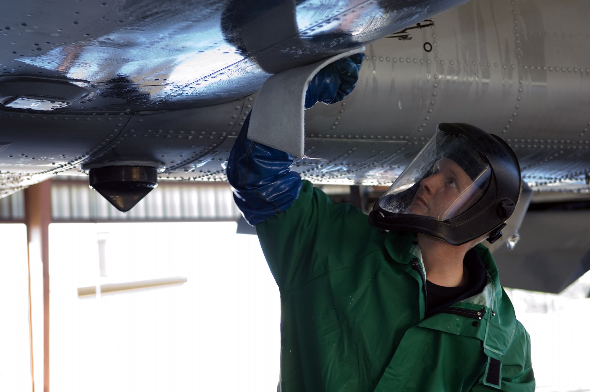 Airman 1st Class Joshua Norris washes the under-belly of an A-10 Thunderbolt II Nov.19 at the corrosion control wash rack at Moody Air Force Base, Ga. The A-10 receives a thorough wash-down and lubrication every three months to prevent corrosion and to inspect for surface damage. Airman Norris is a 23rd Aircraft Maintenance Squadron A-10 crew chief. (U.S. Air Force photo/Senior Airman Elizabeth Rissmiller) 
