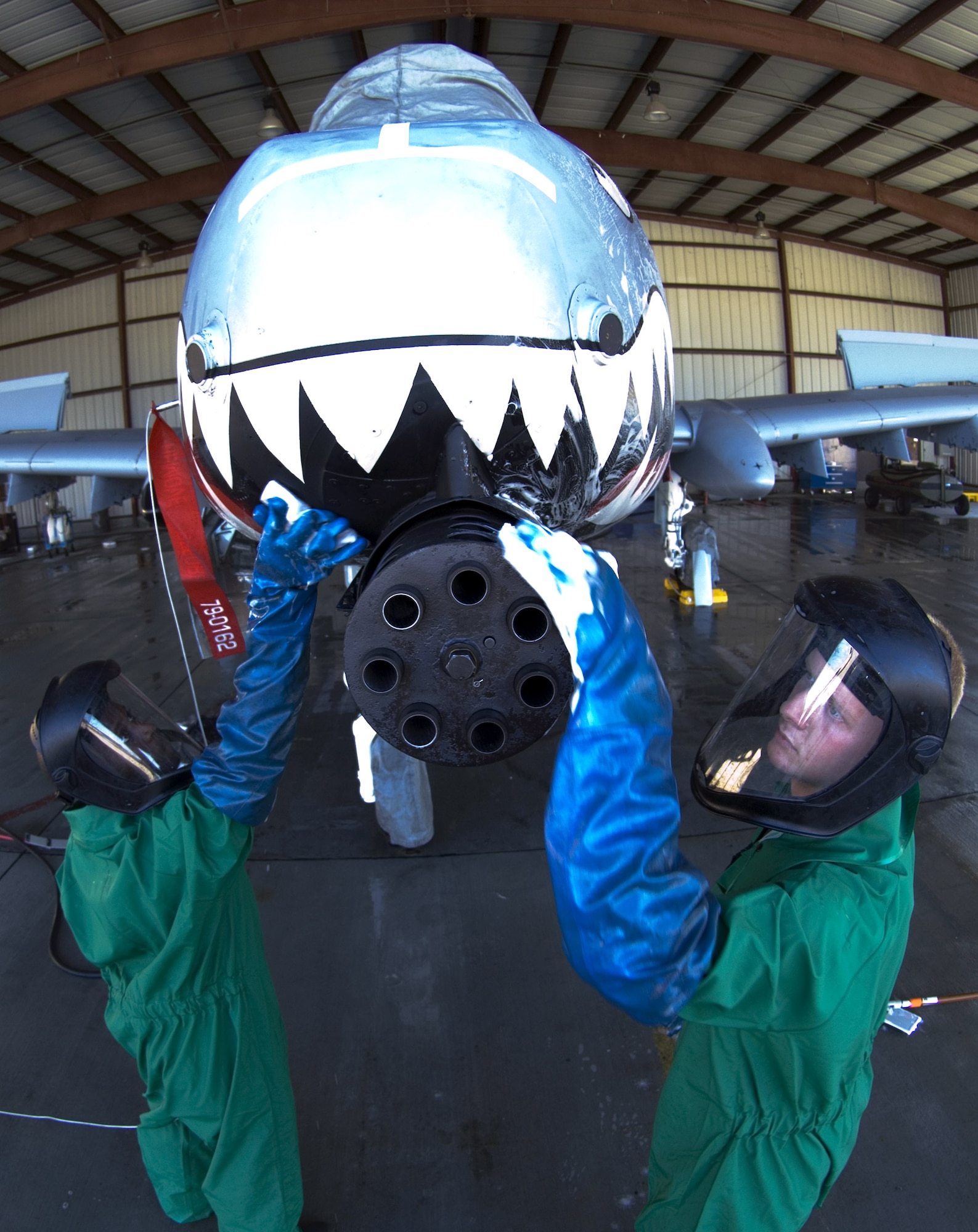 Senior Airman Michael Holmes and Airman 1st Class Joshua Norris wash an A-10 Thunderbolt II Nov. 19 at the corrosion control wash rack at Moody Air Force Base, Ga. The A-10 receives a thorough wash-down and lubrication every three months to prevent corrosion and to inspect for surface damage. The Airmen are assigned to the 23rd Aircraft Maintenance Squadron. (U.S. Air Force photo/Senior Airman Elizabeth Rissmiller) 
