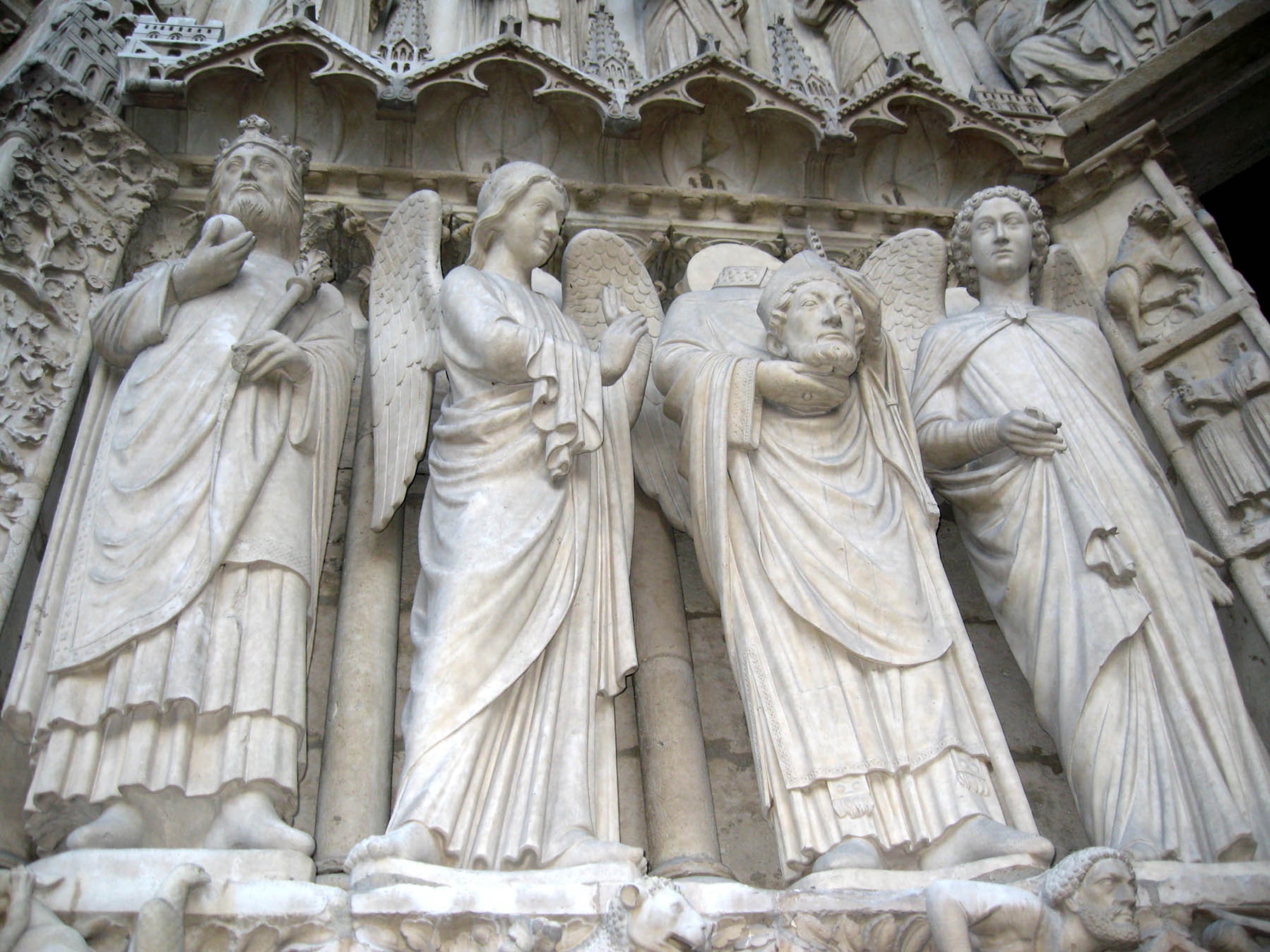 PARIS – Saint Denis, “The Headless Saint,” was the first Bishop of Paris. He became a martyr after being beheaded by a sword in approximately 250. This Saint Denis statue is part of the architecture of the Notre Dame Cathedral. (U.S. Air Force photo/Staff Sgt. Tammie Moore)