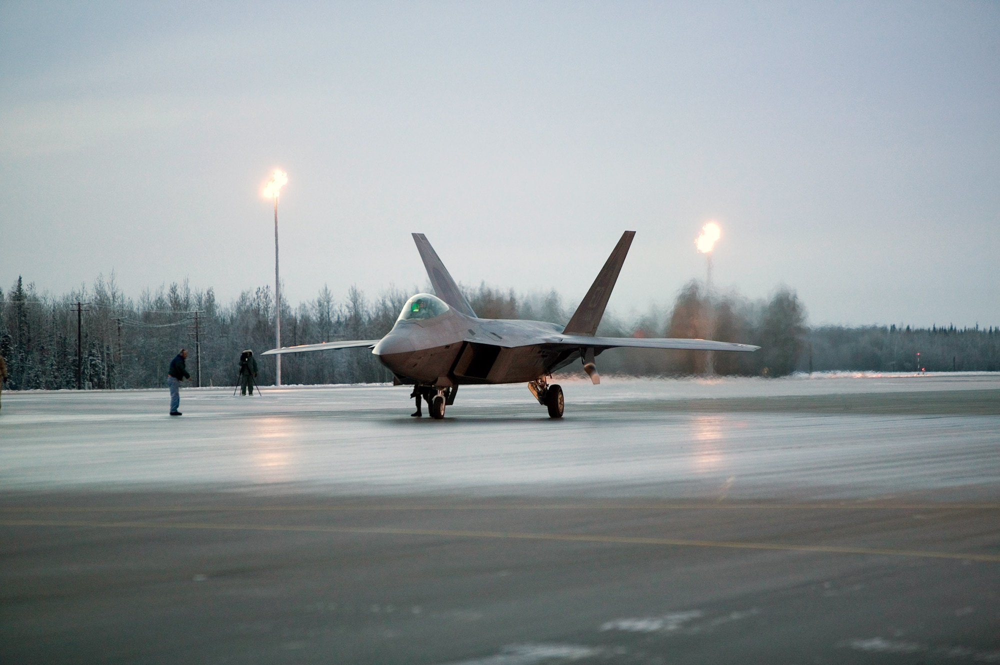 An F-22 Raptor performs manuevering, stopping and going on low runway conditions Nov. 7 at Eielson Air Force Base, Alaska. The F-22 underwent cold-weather testing on its braking system, with emphasis on its ability to maneuver, stop and go on slippery surfaces. The aircraft was tested by the 411th Flight Test Squadron during a three-week deployment on incrementally low-level runway condition reading surfaces, with temperatures ranging between 37 to -13 degrees. The F-22 is from Edwards AFB, Calif. (U.S. Air Force photo/Kevin Roberston) 
