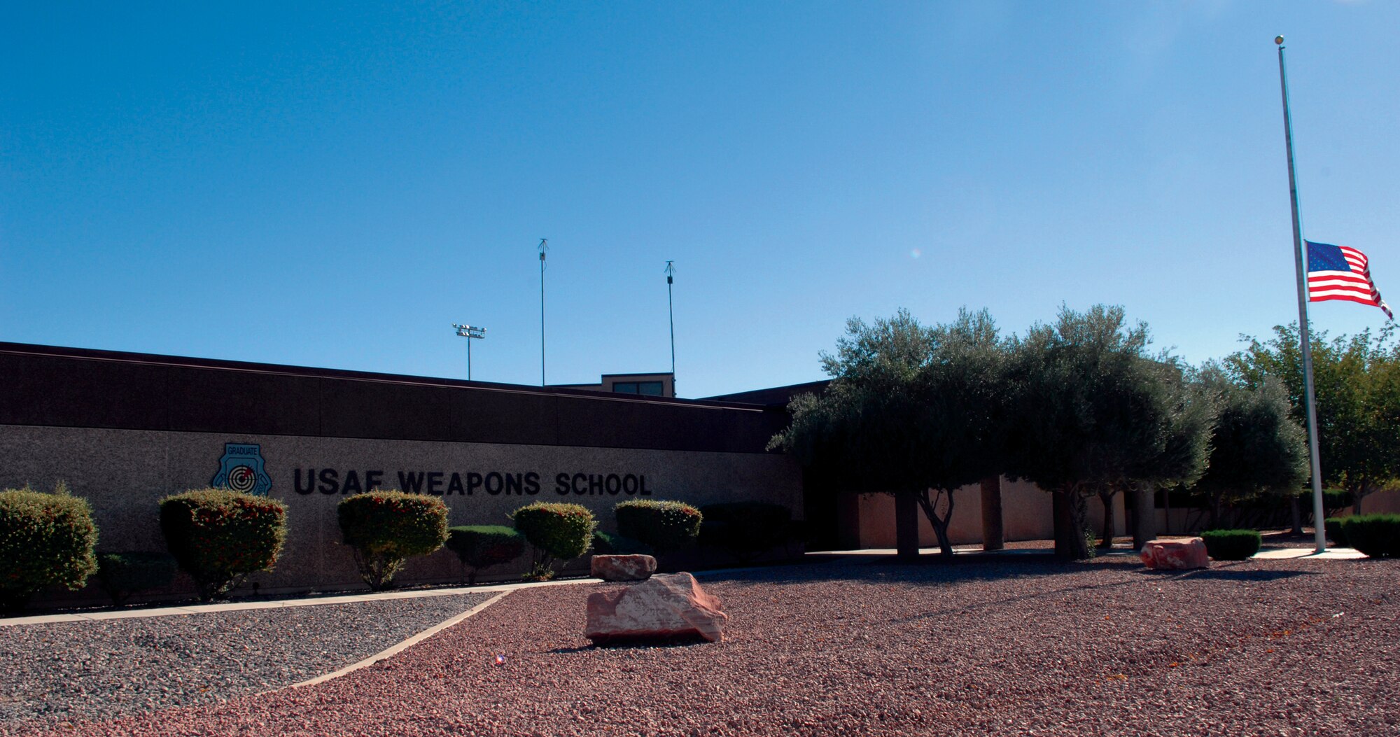 Building 282 at Nellis AFB, Nev., serves as headquarters for the U.S. Air Force Weapons School.  Nine of the 16 weapons squadrons are located at Nellis, including the F-15, F-16, A-10, and upon completion of current facility maintenance, the F/A-22 Raptor. (U.S. Air Force photo by Senior Airman Larry Reid Jr.)