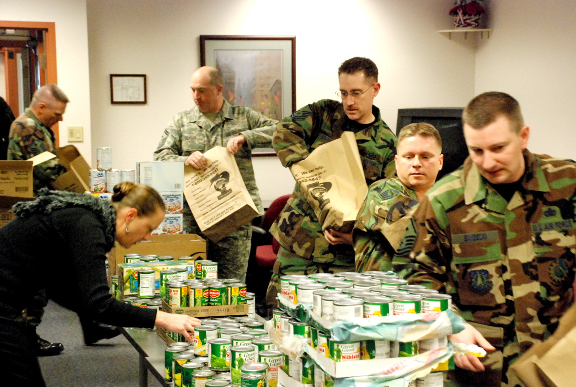 Warren’s First Sergeants Group fills Thanksgiving baskets for needy Airman around base at the airman and family readiness center Nov. 19. The First Sergeants Group supplied almost 112 families with bags filled with canned vegetables, fresh rolls, cranberry sauce, stuffing, sweet potatoes, mashed potatoes and corn bread. They also delivered checks to each family so that they could buy turkeys and other perishable from the commissary so that none of the families would go without a Thanksgiving meal (Photo by Staff Sgt. Chad Thompson).