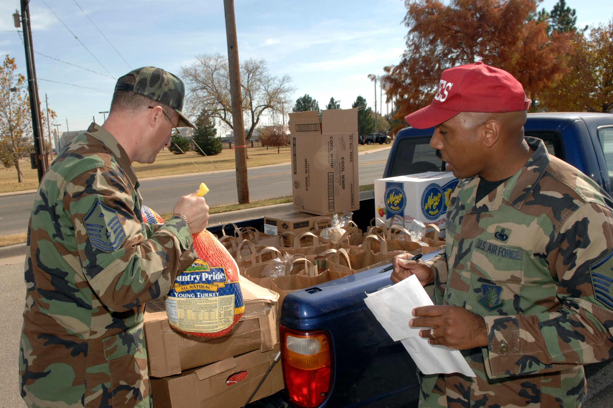 ALTUS AIR FORCE BASE, Okla. -- First sergeants provide Thanksgiving dinners for Jr. NCO’s, Airmen and their  families Nov. 19. The ‘Sharing the Joy of Thanksgiving’ program is an annual program sponsored by the Altus Christian Fellowship Church and is in its 5th year.  It started with only 25 dinners being donated the first year and have worked its way up to 125 meals for the last two years. 
