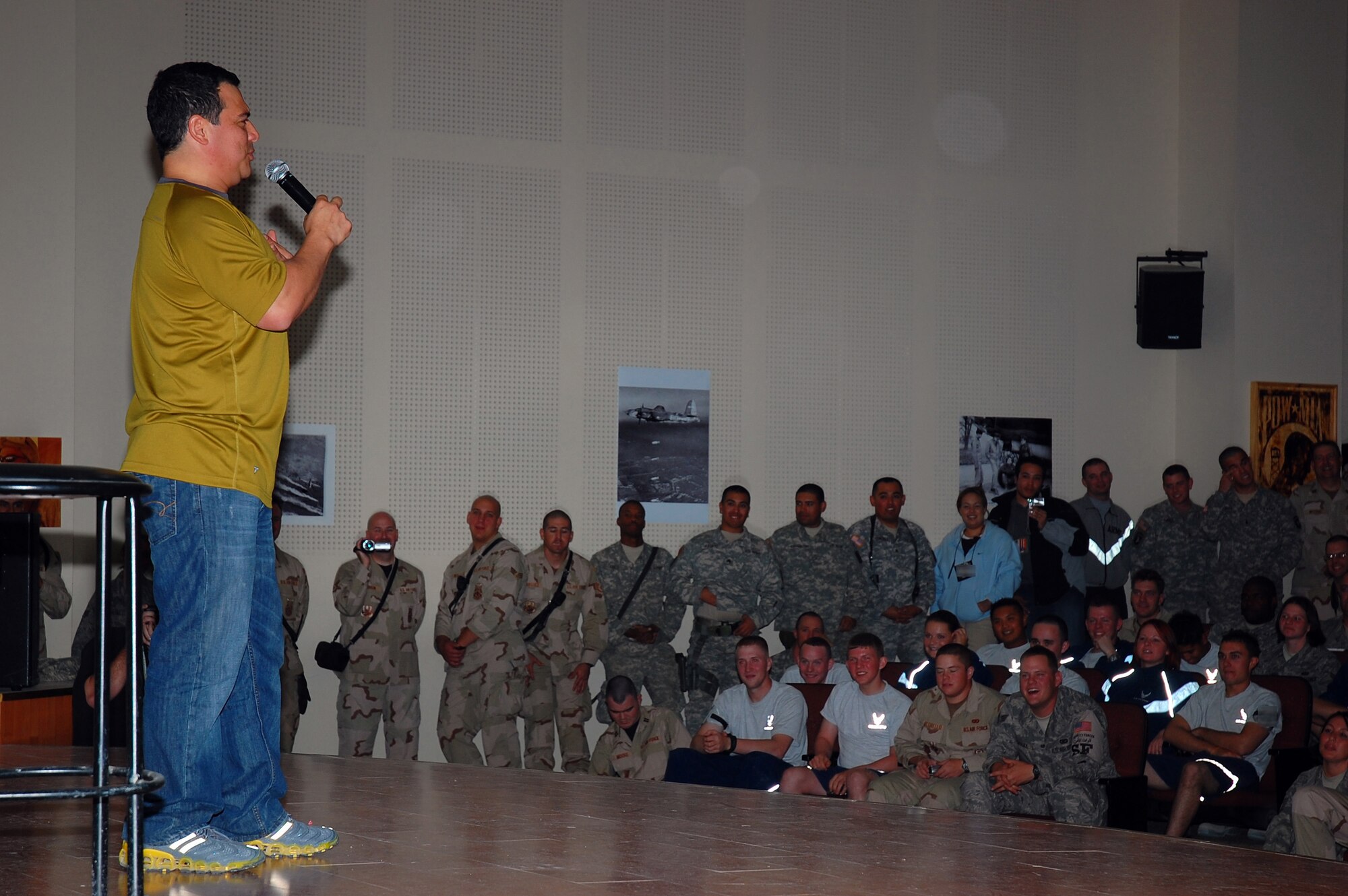 Comedian Carlos Mencia entertains members of the 386th Air Expeditionary Wing Nov. 28 in Southwest Asia. Mr. Mencia and his crew traveled throughout the Middle East providing entertainment for deployed servicemembers. (U.S. Air Force photo/Staff Sgt. Tia Schroeder) 
