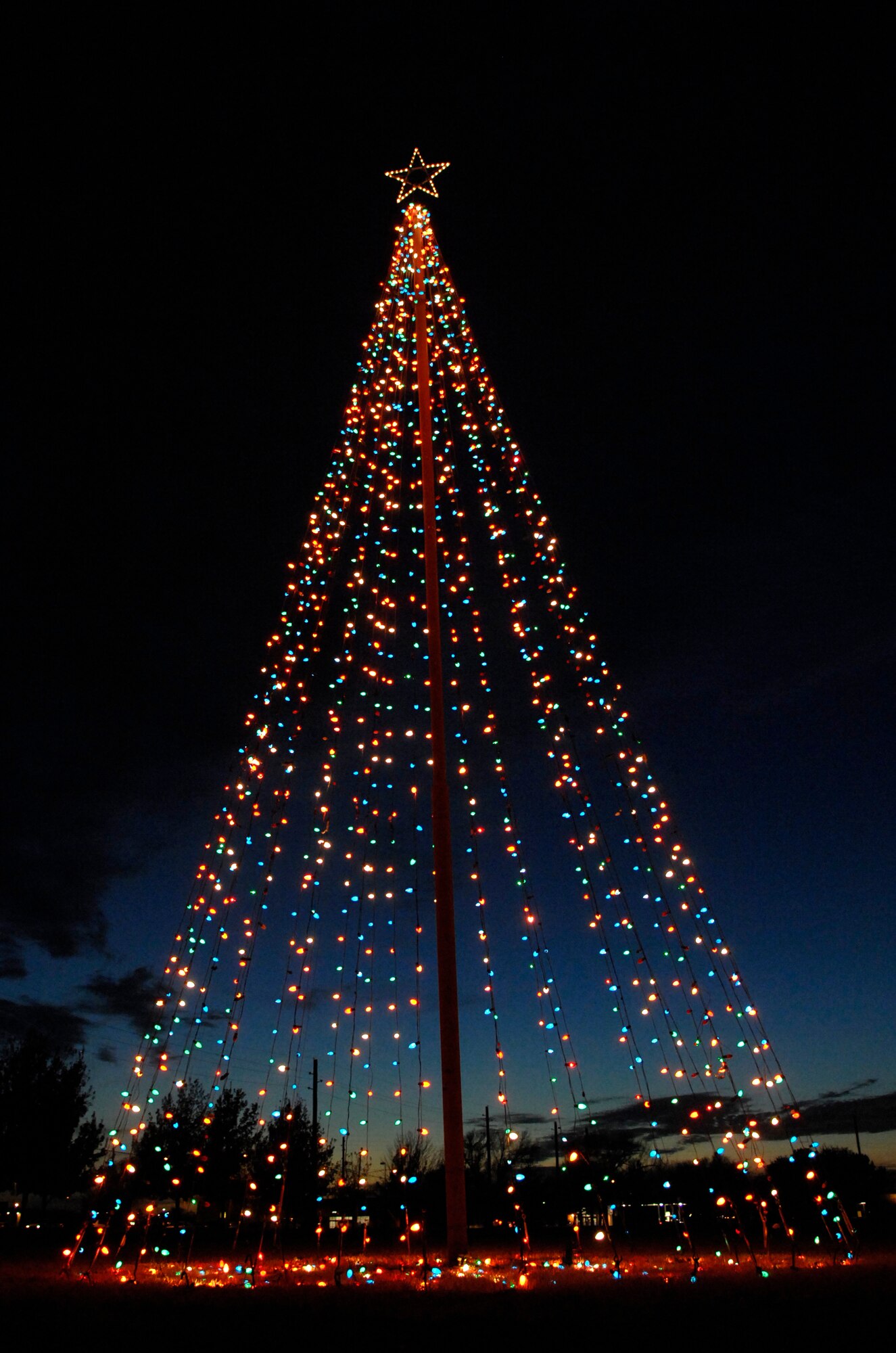 ALTUS AIR FORCE BASE, Okla. -- Altus Air Force Base officially entered the holiday season with the annual base Tree Lighting Ceremony Wednesday evening. Prior to the ceremony refreshments were served at Club Altus by the chapel staff, Santa Claus made his customary appearance and school students sang a melody of carols. Sunday is the start of Advent. Protestant and Catholic Advent services will be held at the base chapel. (U.S. Air Force/Senior Airman Joshua DeMotts)