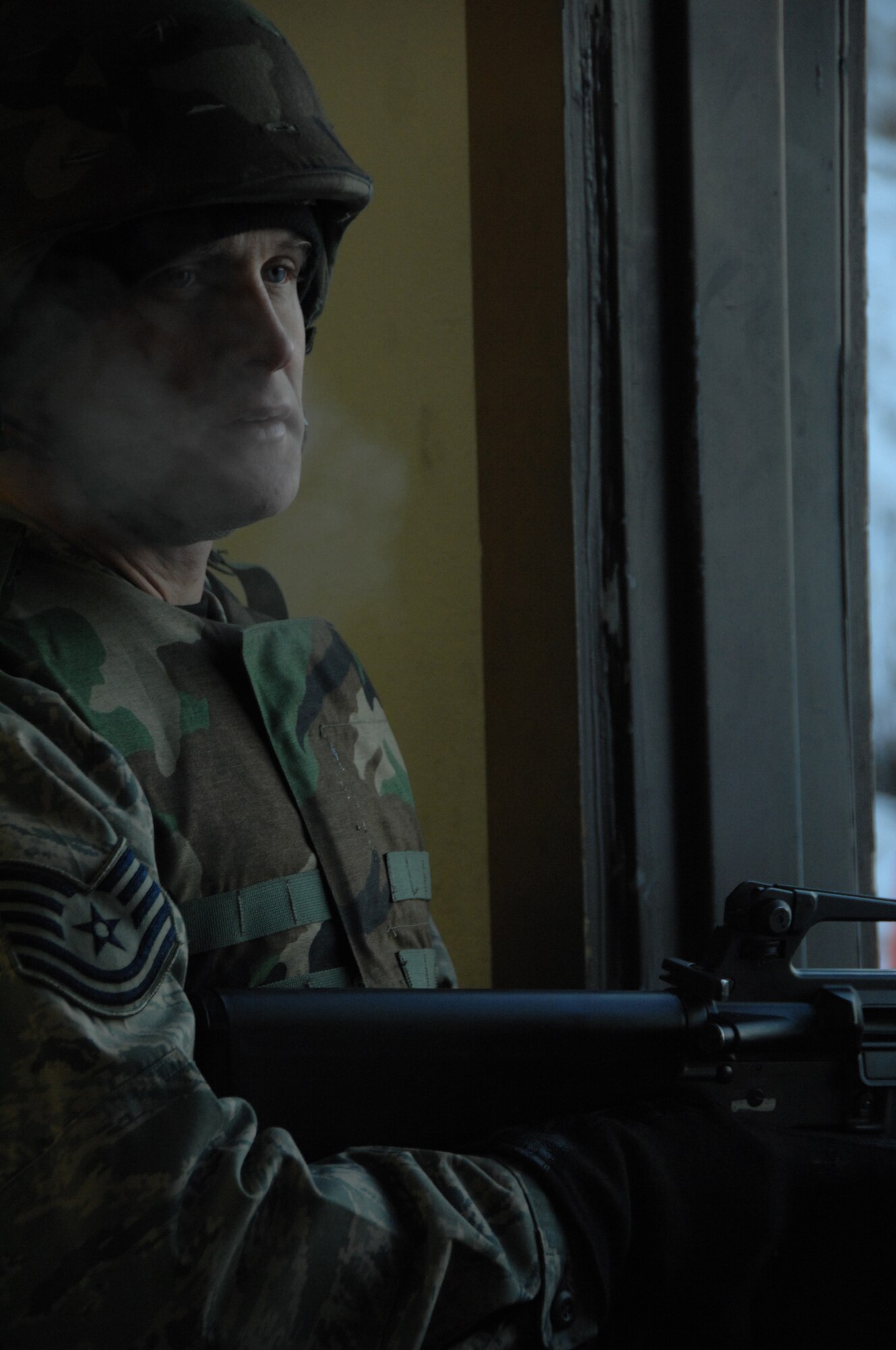 EIELSON AIR FORCE BASE, Alaska -- Tech. Sgt. Jamie Brown, 354th Aircraft Maintenance Squadron section chief, awaits instructions before he fires his M16 down range Nov. 29, 2007 at the small arms firing range. Eielson's small arms range trains roughly more than 1,900 people with the M16 and M4 rifles and M9 pistol per year, the range is still capable of qualifying Airmen for firearms in arctic temperatures, going as low as negative 40 degrees.  (U.S. Air Force photo by Airman 1st Class Christopher Griffin)