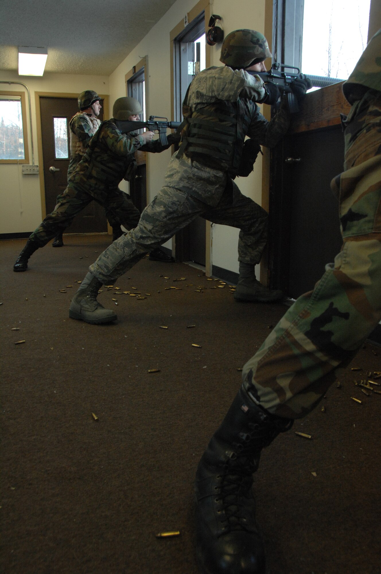 EIELSON AIR FORCE BASE, Alaska -- Airmen fire M16s downrange Nov. 29, 2007 at the small arms range. The Eielson small arms range currently has the capability to train people to use the M16A2, M4, M9, M11, M24, M870, M249, M203, AT4, and the MK19 automatic grenade launcher, they also have the capability to fire any time, day or night, to support any short notice deployers (U.S. Air Force photo by Airman 1st Class Christopher Griffin)