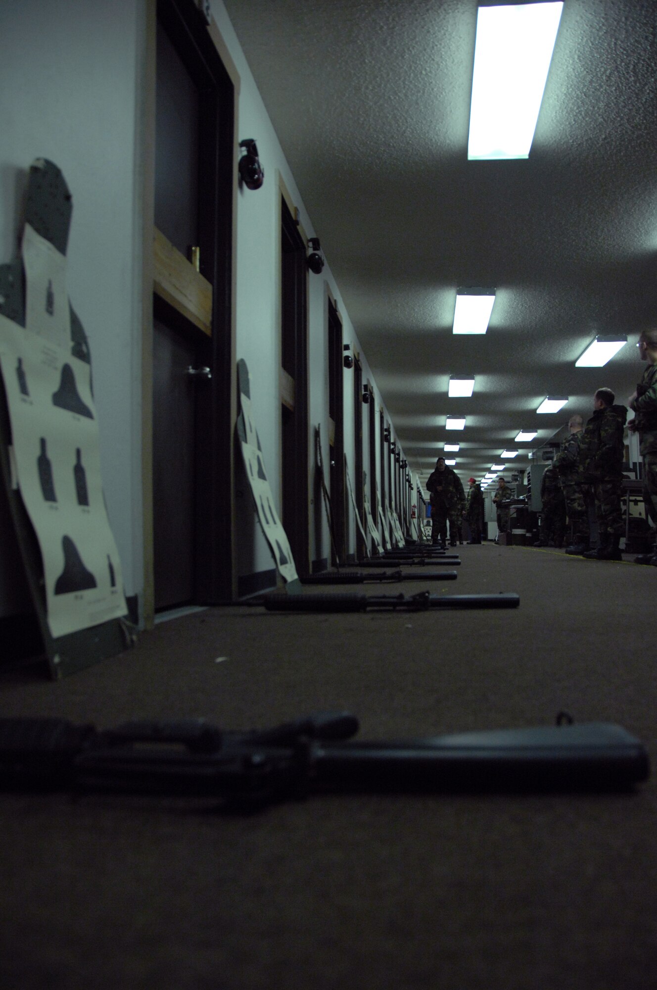 EIELSON AIR FORCE BASE, Alaska -- Airmen prepare to shoot down range in Alaska's arctic temperatures Nov. 29, 2007 at the small arms range. Eielson's small arms range trains roughly more than 1,900 people with the M16 and M4 rifles and M9 pistol per year, the range is still capable of qualifying Airmen for firearms in arctic temperatures, going as low as negative 40 degrees.  (U.S. Air Force photo by Airman 1st Class Christopher Griffin)