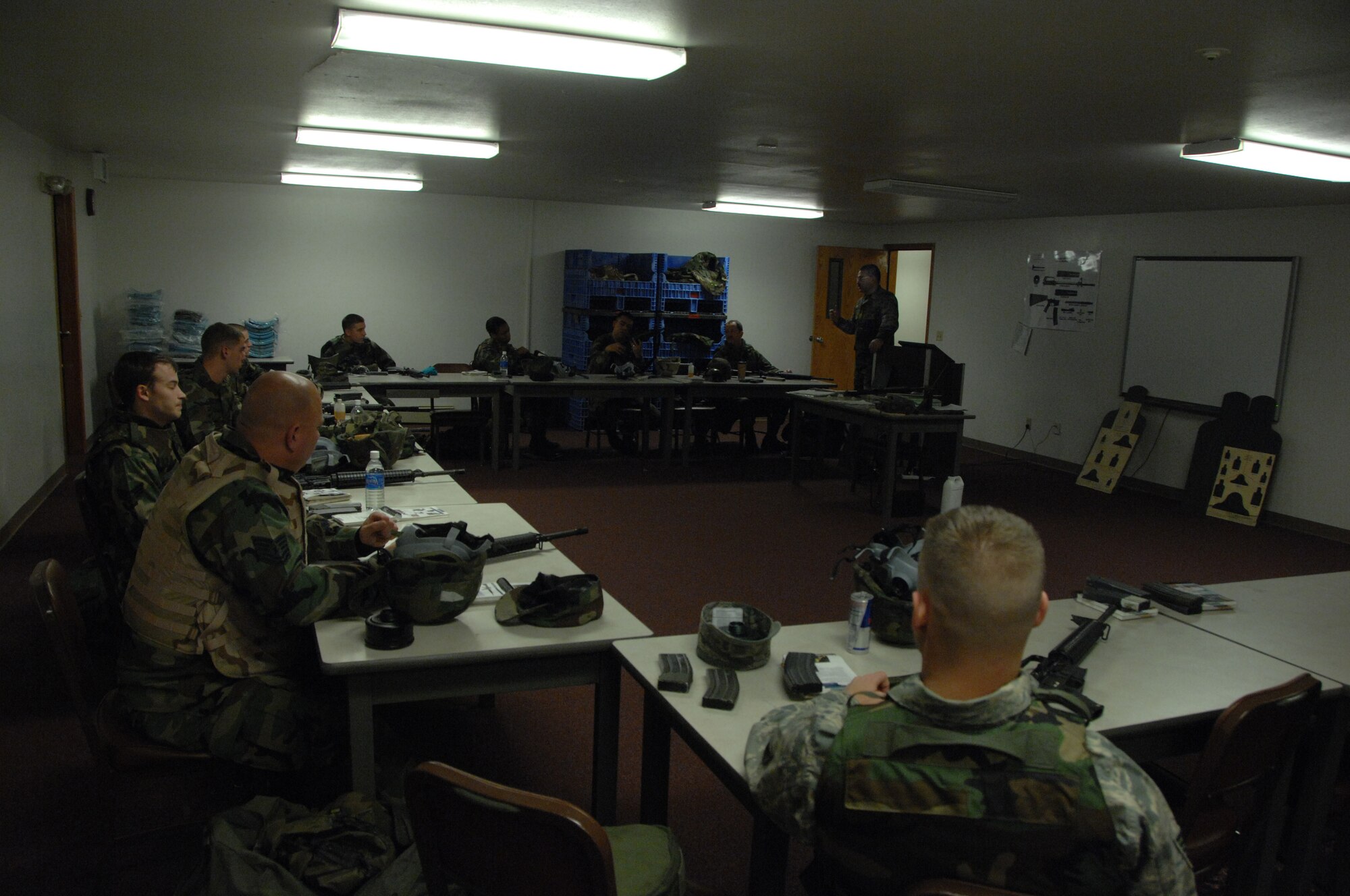EIELSON AIR FORCE BASE, Alaska -- Airmen listen to Tech. Sgt. William Diebold, 354th Security Forces Squadron combat arms instructor, on the importance of safety when firing down range with the M16 Nov. 29, 2007 at the small arms range. Shooting at Eielson gives more opportunities to train with different weapons because of the impact range, such weapons include M16A2, M4, M9, M11, M24, M870, M249, M203, AT4, and the MK19 automatic grenade launcher.  (U.S. Air Force photo by Airman 1st Class Christopher Griffin)