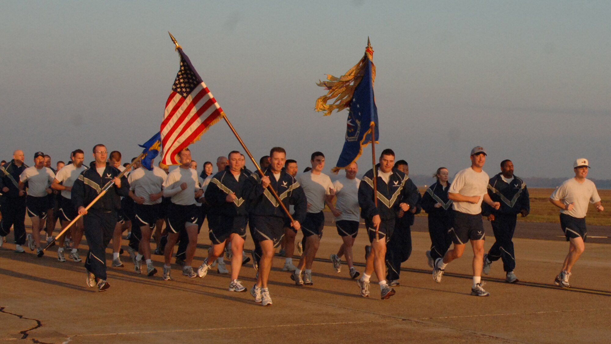 Master Sgt. Allen Ridgon, 14th Flying Training Wing First Sergeant, Chief MASter Sgt. Ron Bowlan, 14th FTW Command Chief Master Sergeant, Col. Dave Gerber, 14th FTW commander, and Col. Jeff Dunn, 14th FTW vice commander, lead the formation for the two mile Warrior Run at sunrise, Nov. 20. (U.S. Air Force photo by Airman 1st Class Danielle Powell)