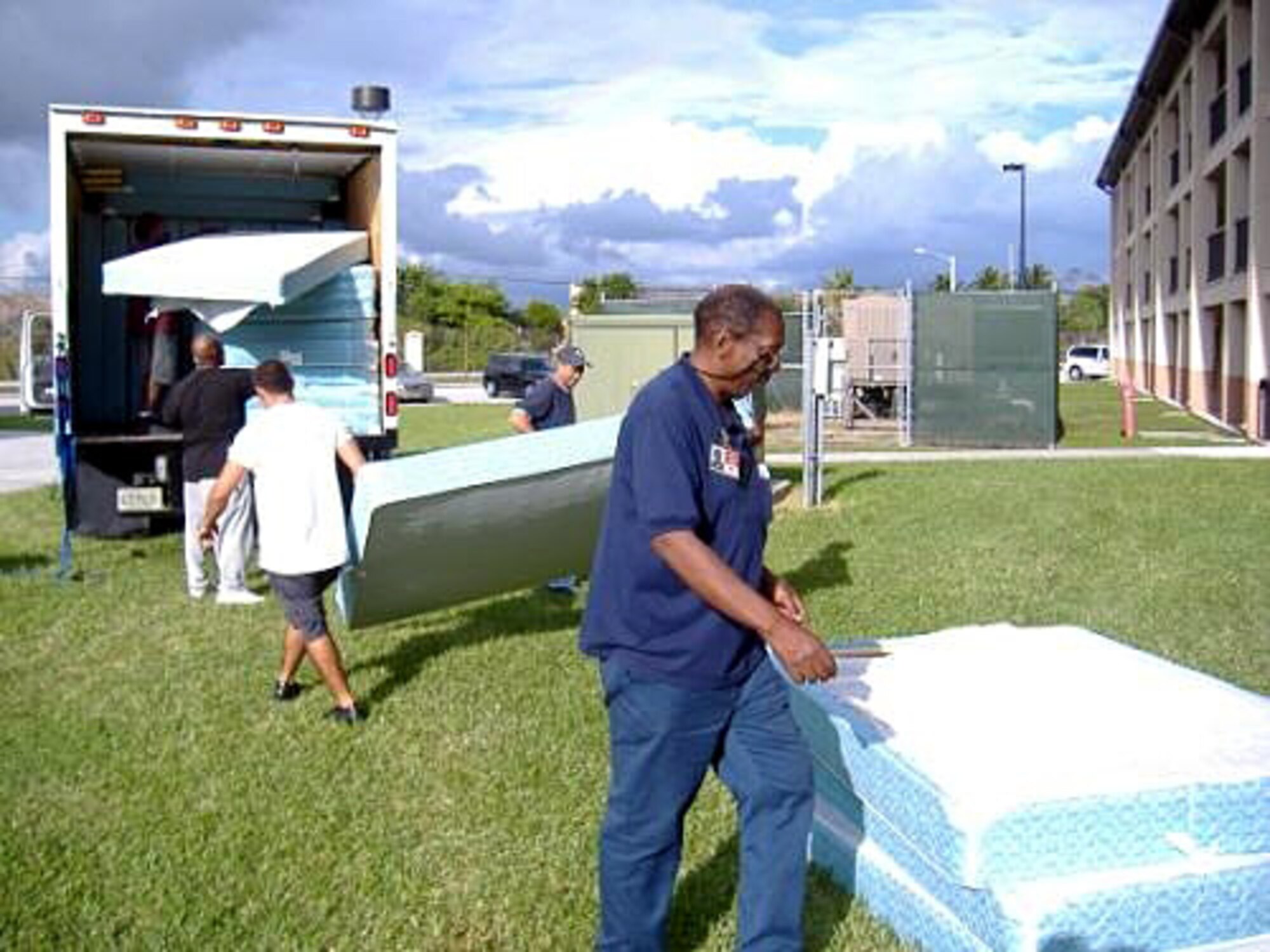 Community Partnership for the Homeless employees load up mattresses donated by the Homestead Inn that will be given to families transitioning from the homeless shelter into new apartments. A total of 131 mattresses and box spring sets were given away after the Homestead Inn received new beds. (Courtesy Photo)