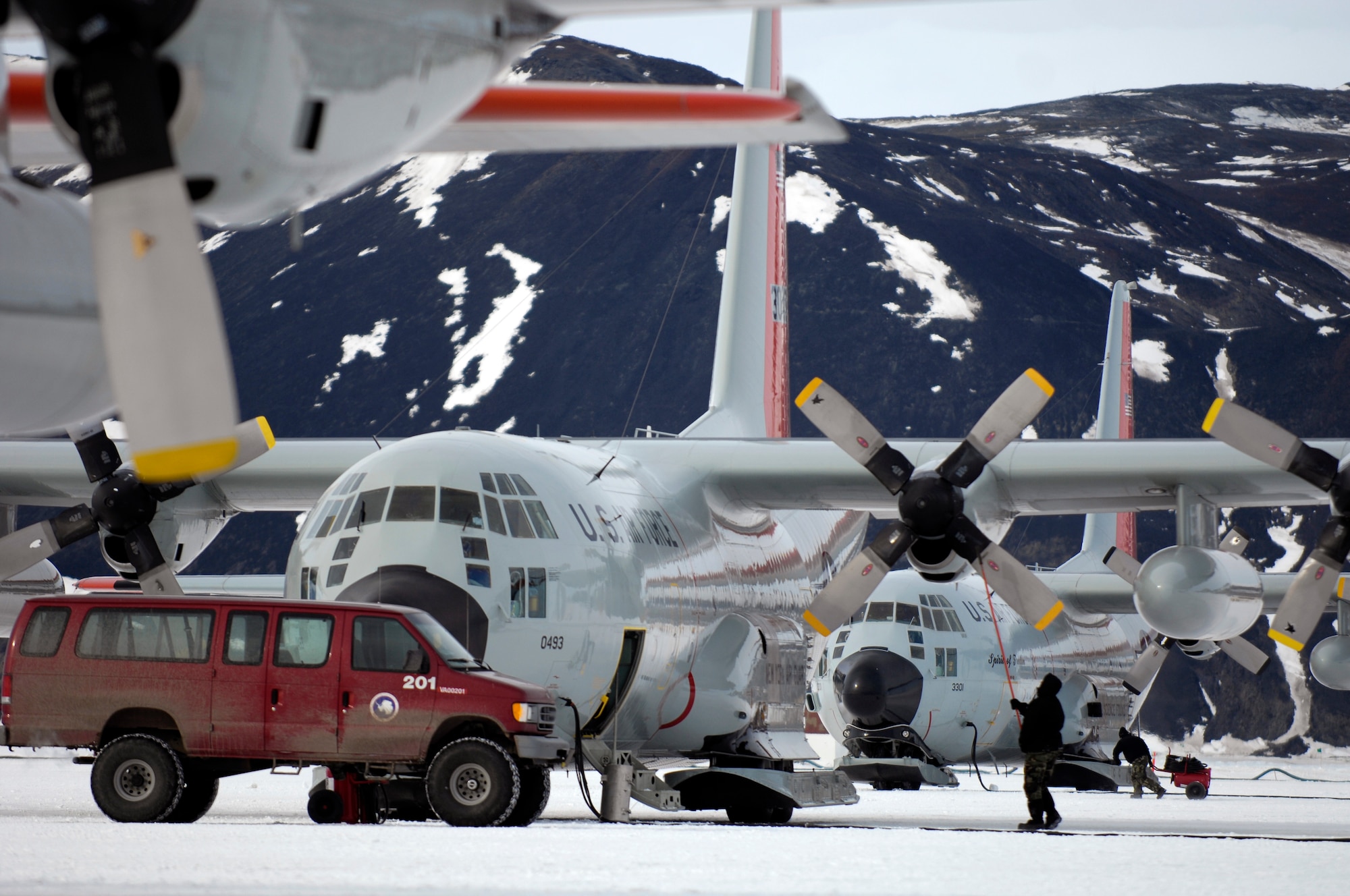 Maintenance crews work on LC-130 Hercules on the annual sea ice runway near McMurdo Station, Antarctica Nov. 26, 2007 during Operation Deep Freeze. Ski-equipped LC-130s, crews and support personnel from the New York Air National Guard’s 109th Airlift Wing are supporting the 13th Air Force-led Joint Task Force Support Forces Antarctica, Operation Deep Freeze. Operation Deep Freeze is a unique joint and total force mission that has supported the National Science Foundation and U.S. Antarctic Program that began in 1955. (U.S. Air Force photo/Tech. Sgt. Shane A. Cuomo)