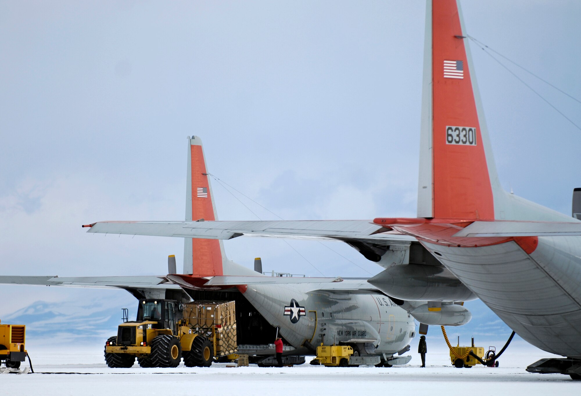 An LC-130 Hercules is loaded on the annual sea ice runway near McMurdo Station, Antarctica Nov. 26, 2007 during Operation Deep Freeze. Ski-equipped LC-130s, crews and support personnel from the New York Air National Guard’s 109th Airlift Wing are supporting the 13th Air Force-led Joint Task Force Support Forces Antarctica, Operation Deep Freeze. Operation Deep Freeze is a unique joint and total force mission that has supported the National Science Foundation and U.S. Antarctic Program that began in 1955. (U.S. Air Force photo/Tech. Sgt. Shane A. Cuomo)