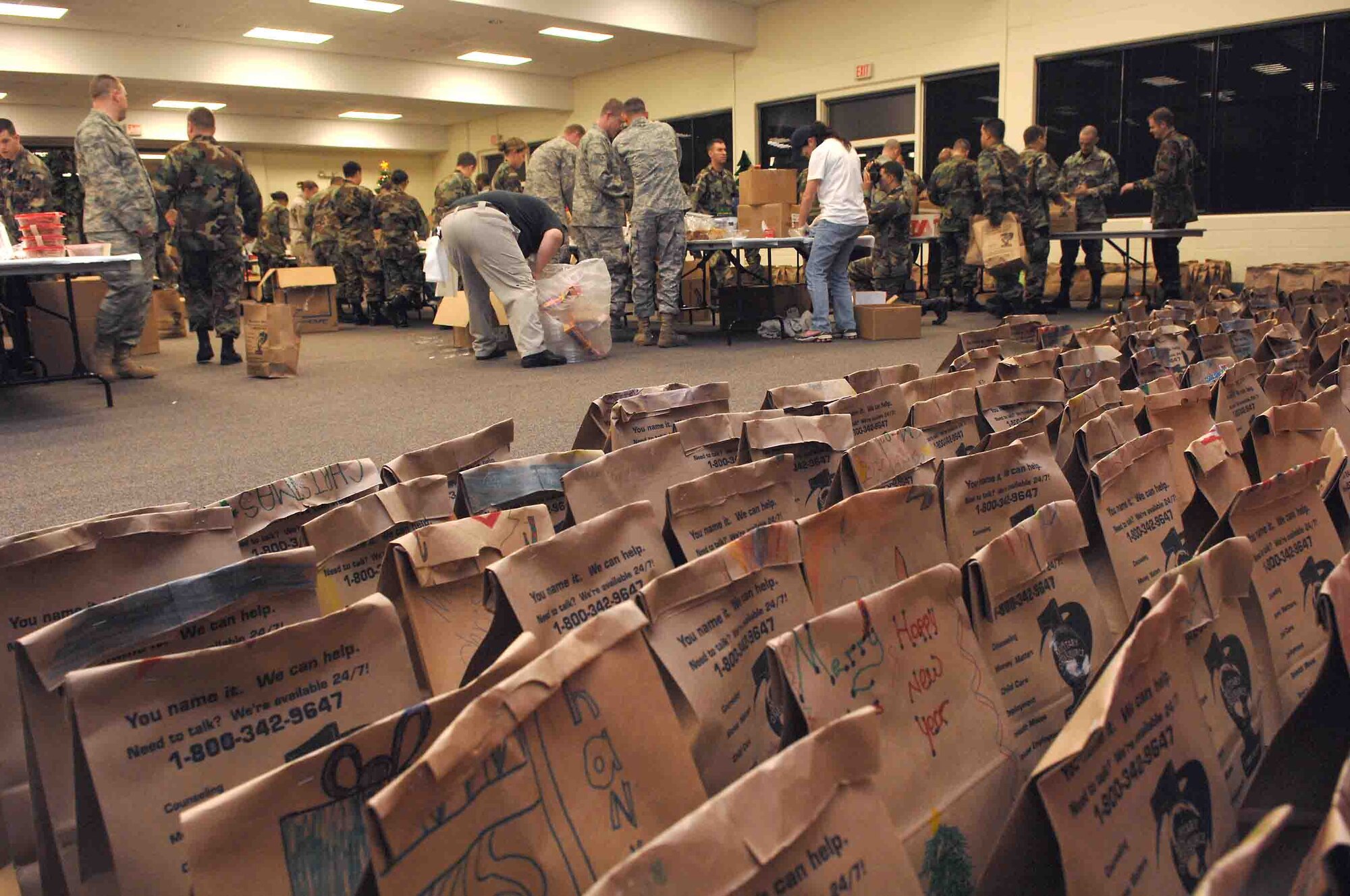 SHAW AIR FORCE BASE, S.C. -- Airman Leadership School students box and bag cookies during the Shaw's cookie drive Nov. 29. The cookie drive is sponsored by the Enlisted Spouses Club and the Officer and Civilian Spouses Club. They received more than 60,000 cookies this year from local community and base volunteers.  (U.S. Air Force photo/Airman 1st Class William Coleman)