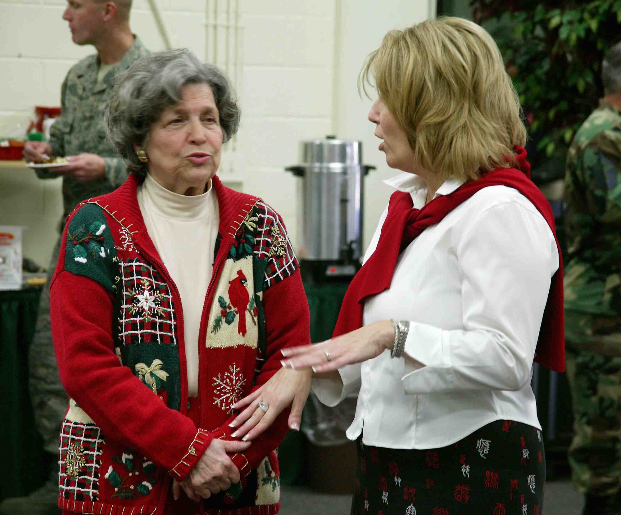 SHAW AIR FORCE BASE, S.C. -- Jo Anne Morris (left), Sumter Volunteers Inc., talks with Susan Post during the Shaw Cookie Drive kickoff Nov. 30 at the Community Activities Center. The Airman's cookie drive, sponsored by the Enlisted Spouses Club and the Officer and Civilian Spouses Club, received more than 60,000 cookies this year from local community and base volunteers. The cookies are distributed to Airmen across Shaw and to deployed Airmen and Soldiers as well. (U.S. Air Force photo/Staff Sgt. John Gordinier)
