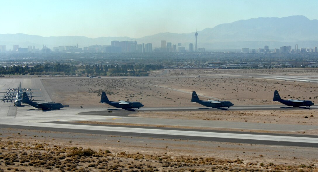 C-130 Hercules aircraft taxi to the parking ramp at Nellis Air Force Base, Nev., after completing airdrop missions for a mobility exercise over the Keno range in Nevada.  (U.S. Air Force photo/Staff Sgt. Scottie McCord)