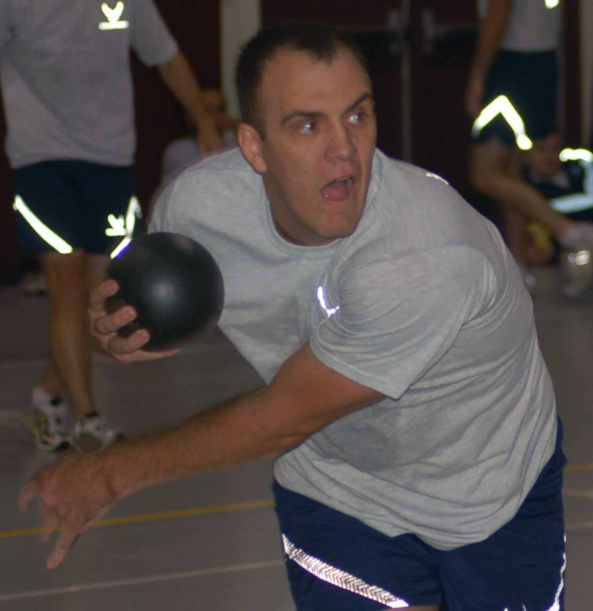 Joshua Allen gives his throws all he’s got during a match in the Airborne Air Control Squadron dodgeball challenge Nov. 22. (Air Force photo by John E. Banks)