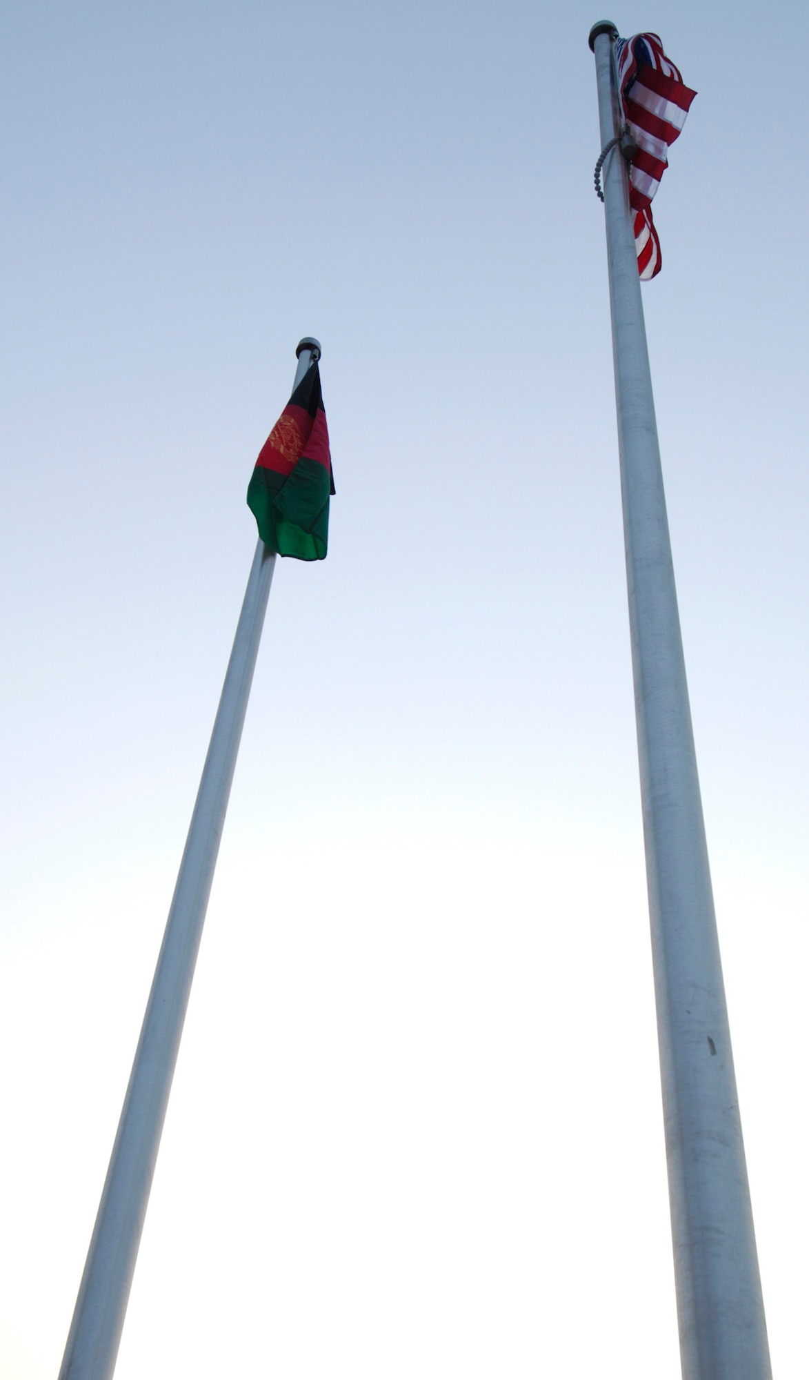 BAGRAM AIR BASE, Afghanistan - The American and Afghan flags are displayed after being raised on two new flagpoles on Camp Cunningham here, Nov. 30, 2007.  (U.S. Air Force photo/Staff Sgt. Joshua T Jasper)  (Released)
