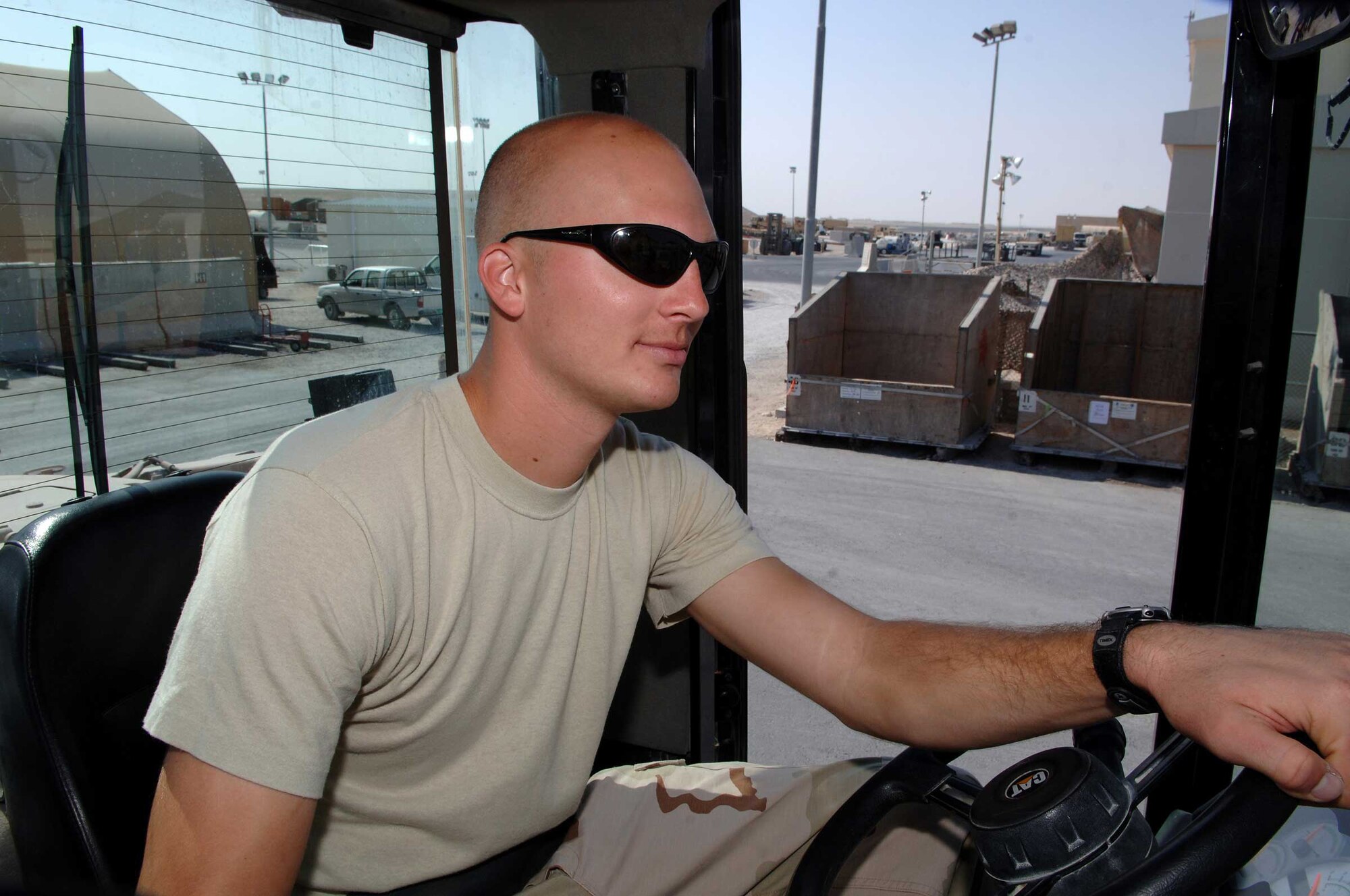 SOUTHWEST ASIA - Tech. Sgt. Ryan Proffit, 8th Expeditionary Air Mobility Squadron, operates an all terrain forklift at a base in Southwest Asia. Sergeant Proffit is deployed from the 139th Airlift Wing in Saint Joseph, Mo. (U.S. Air Force photo/Master Sgt. Greg Kunkle)