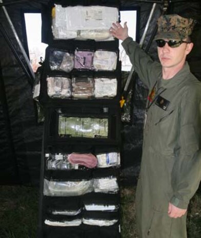 Petty Officer 2nd Class Scott Urey, a hospital corpsman with Chemical Biological Incident Response Force, II Marine Expeditionary Force, displays his medical supplies at the medical stabilization tent here in November. At this tent chemical, biological, radiological, nuclear, or high-yield explosive incident patients would visit for a higher echelon of medical care.