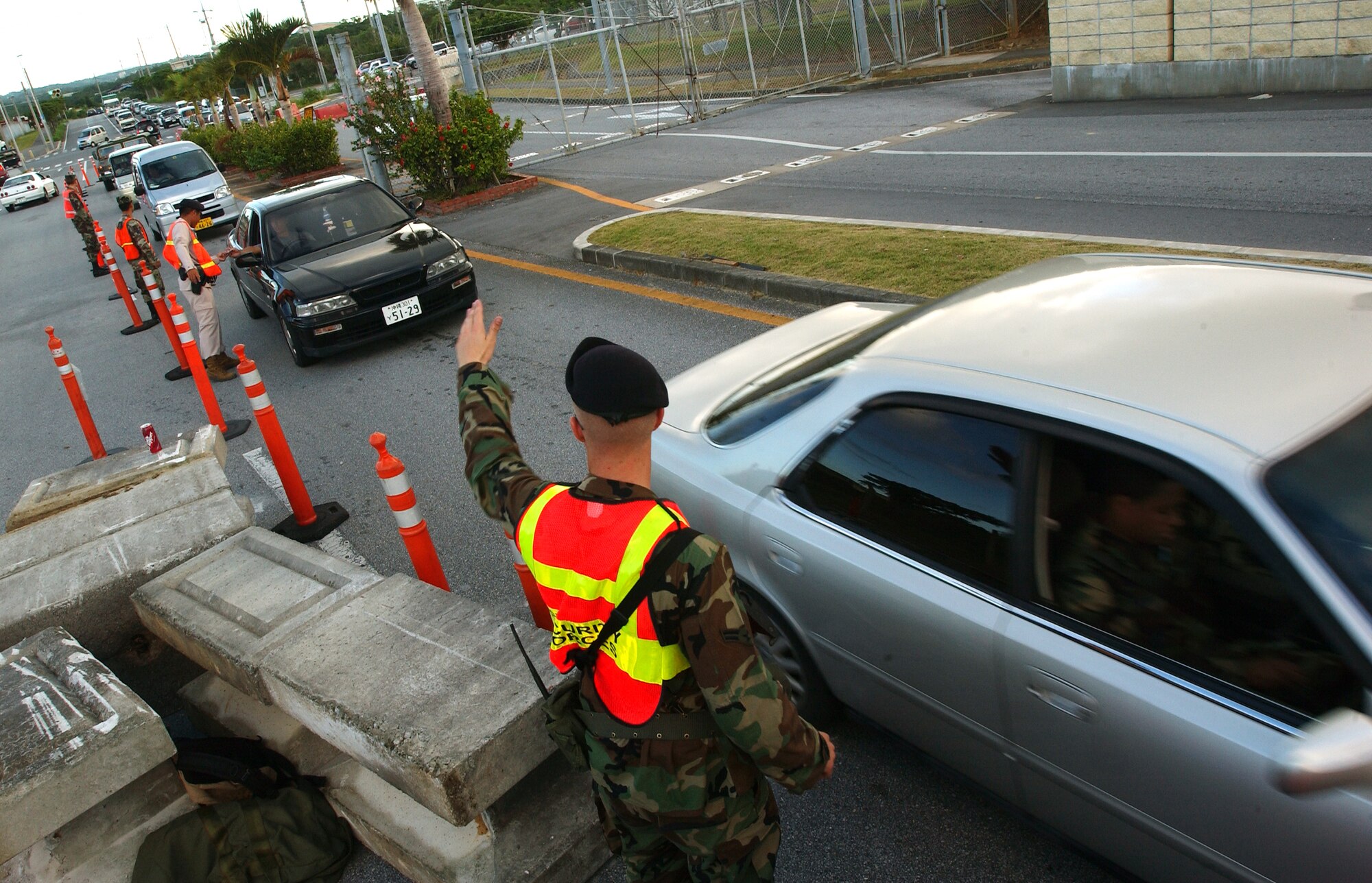 Members of the 18th Security Forces Squadron and augmentees check identification cards at Gate 3. Traffic congestion will cause delays for entry at Gate 3 for approximately six weeks due to construction work that began Oct. 1. Contract workers will be installing final denial barriers in the area. It is recommended for people to use an alternate gate if possible.
(U.S. Air Force photo/Tech. Sgt. Reynaldo Ramon)