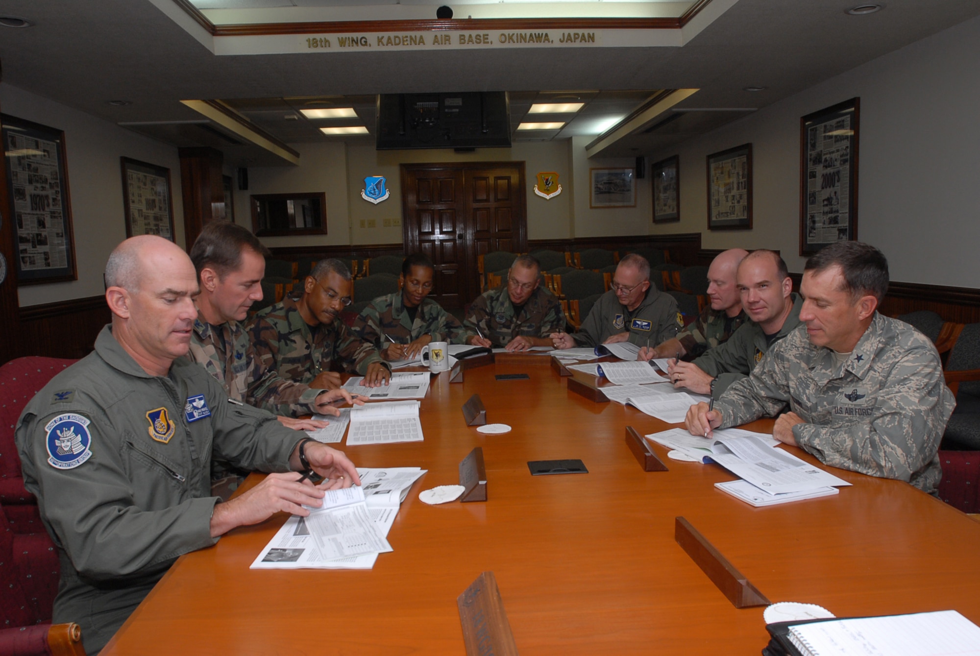 Eighteenth Wing leaders fill out Combined Federal Campaign pledge slips to kick off the CFC season Oct. 1. The CFC, established in 1961 by President John F. Kennedy, provides a single drive for government employees to raise money for many charities. 
(U.S. Air Force photo/Senior Airman Darnell T. Cannady)