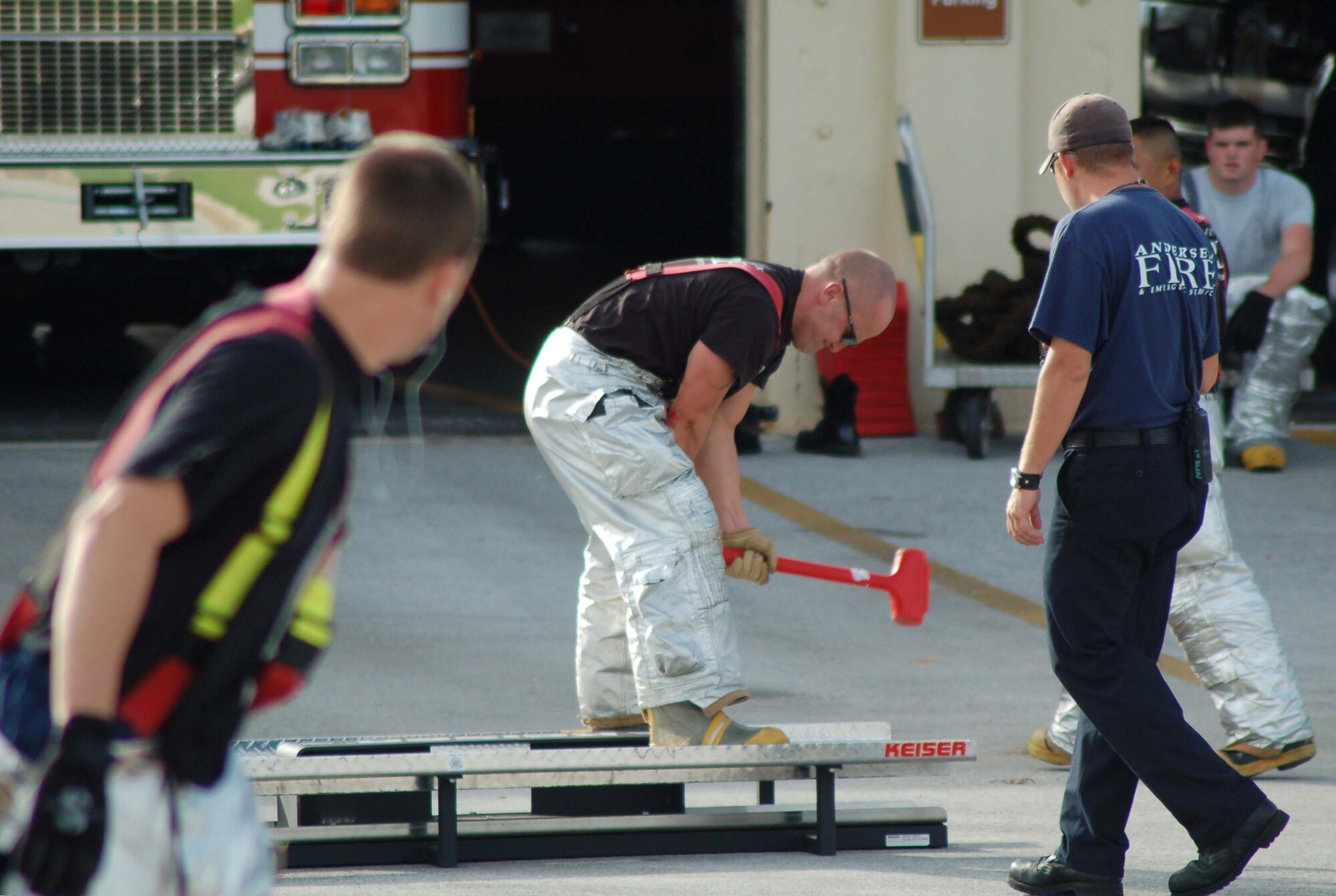 Staff Sgt. Joshua Thompson, 36th Civil Engineer Squadron, hammers on the Keiser sled, which simulates action taken during vertical ventilation. Andersen's fire department is preparing for the Fire Muster Competition scheduled for Oct. 6 and 7. All on-island fire departments, including Guam, Navy and Andersen, will participate. (U.S. Air Force photo/Senior Airman Angelique Smythe)