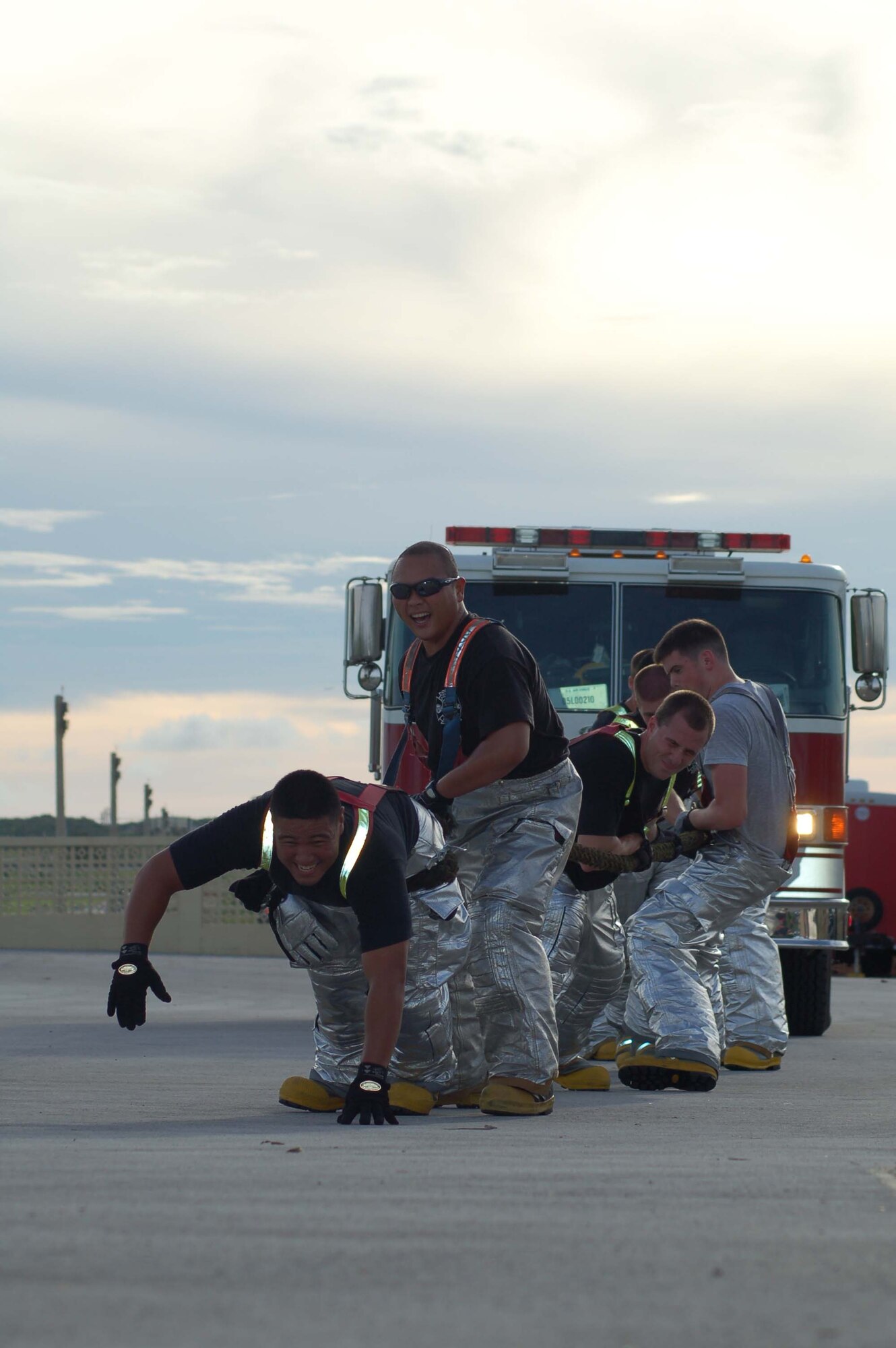 Airman 1st Class Justin Rico, 36th Civil Engineer Squadron, leads the charge in the fire engine pull. Andersen's fire department is preparing for the Fire Muster Competition scheduled for Oct. 6 and 7. All on-island fire departments, including Guam, Navy and Andersen, will participate. (U.S. Air Force photo/Senior Airman Angelique Smythe)