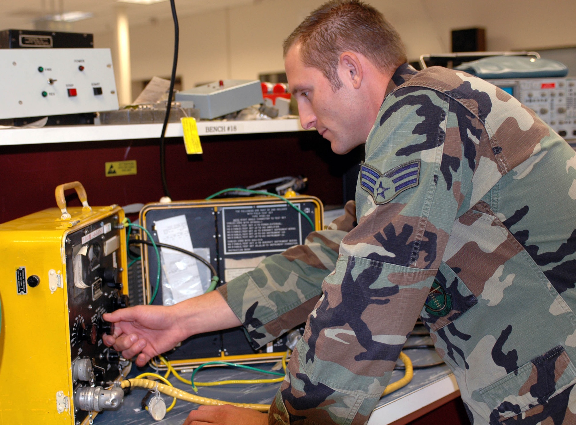 Senior Airman Brock Diruzza, 60th Component Maintenance Squadron's C-5 Avionics technician, powers down a piece of C-5 avionics equipment. As part of a Repair Enterprise for the 21st Century initiative, C-5 Avionics repairs shops, including Travis', will now be part of a regionalized Direct-to-Depot network. (U.S. Air Force photo/Staff Sgt. Candy Knight)