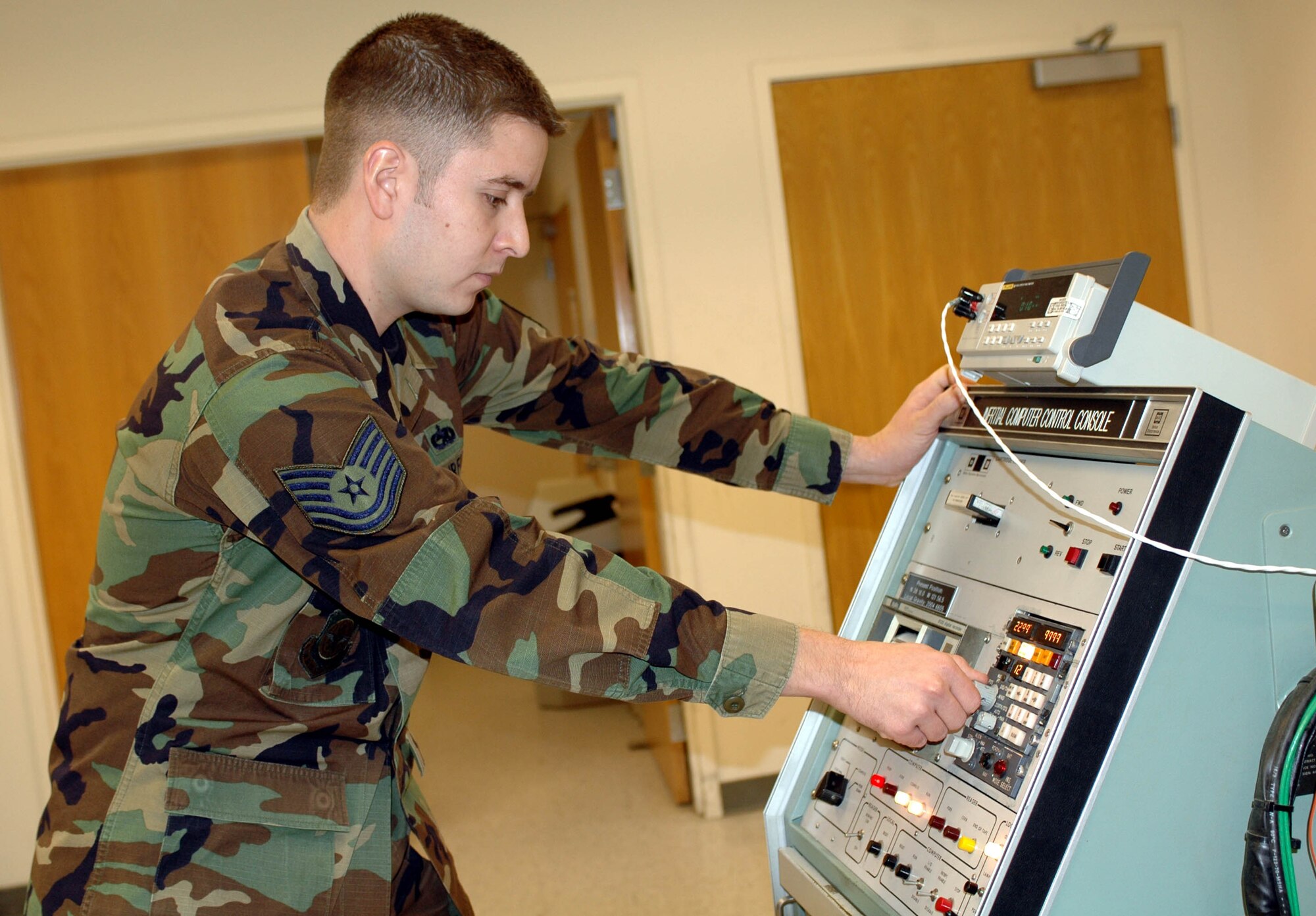 Tech. Sgt. Richard Holbert, 60th Component Maintenance Squadron's C-5 Avionics shift supervisor, test C-5 avionics equipment. The 60th CMS' C-5 Avionics section officially shut down operations Oct. 1. (U.S. Air Force photo/Staff Sgt. Candy Knight)