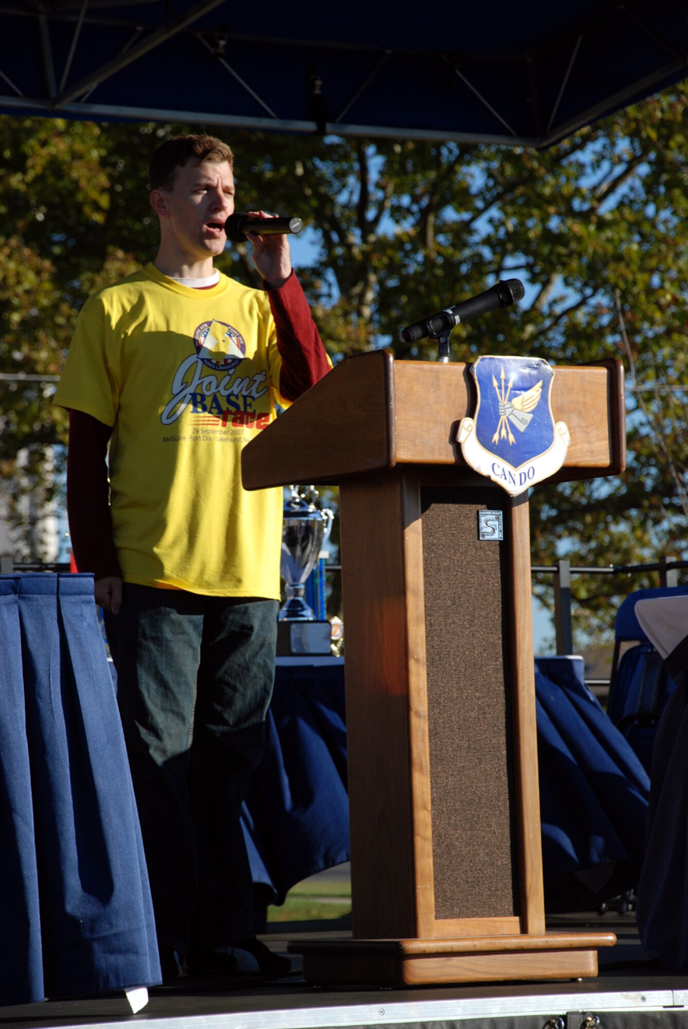 Senior Airman David Weaver, 305th Comptroller Squadron customer service technician, opens the McGuire-Dix-Lakehurst Joint Base Race with the singing of the National Anthem here Sept. 29. Approximately 280 people participated in one of three races: the half marathon; 5K Fun Run/Walk; or the Kids Run. (U.S. Air Force photo/Airman 1st Class Rebekah Phy)