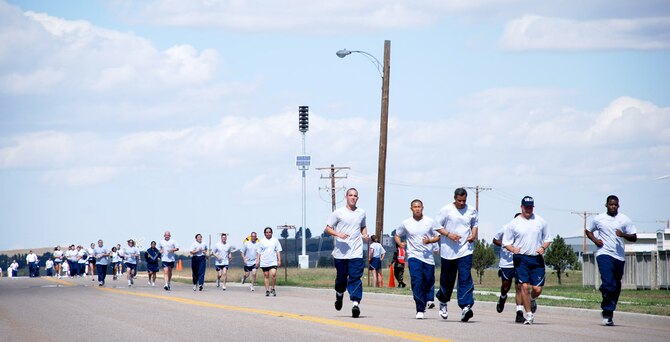 Members of the 90th Space Wing participate in a wing run Sept. 18. The five kilometer run is intended as a morale booster and is performed on the first and third Tuesdays of each month (Photo by Staff Sgt. Kurt Arkenberg).