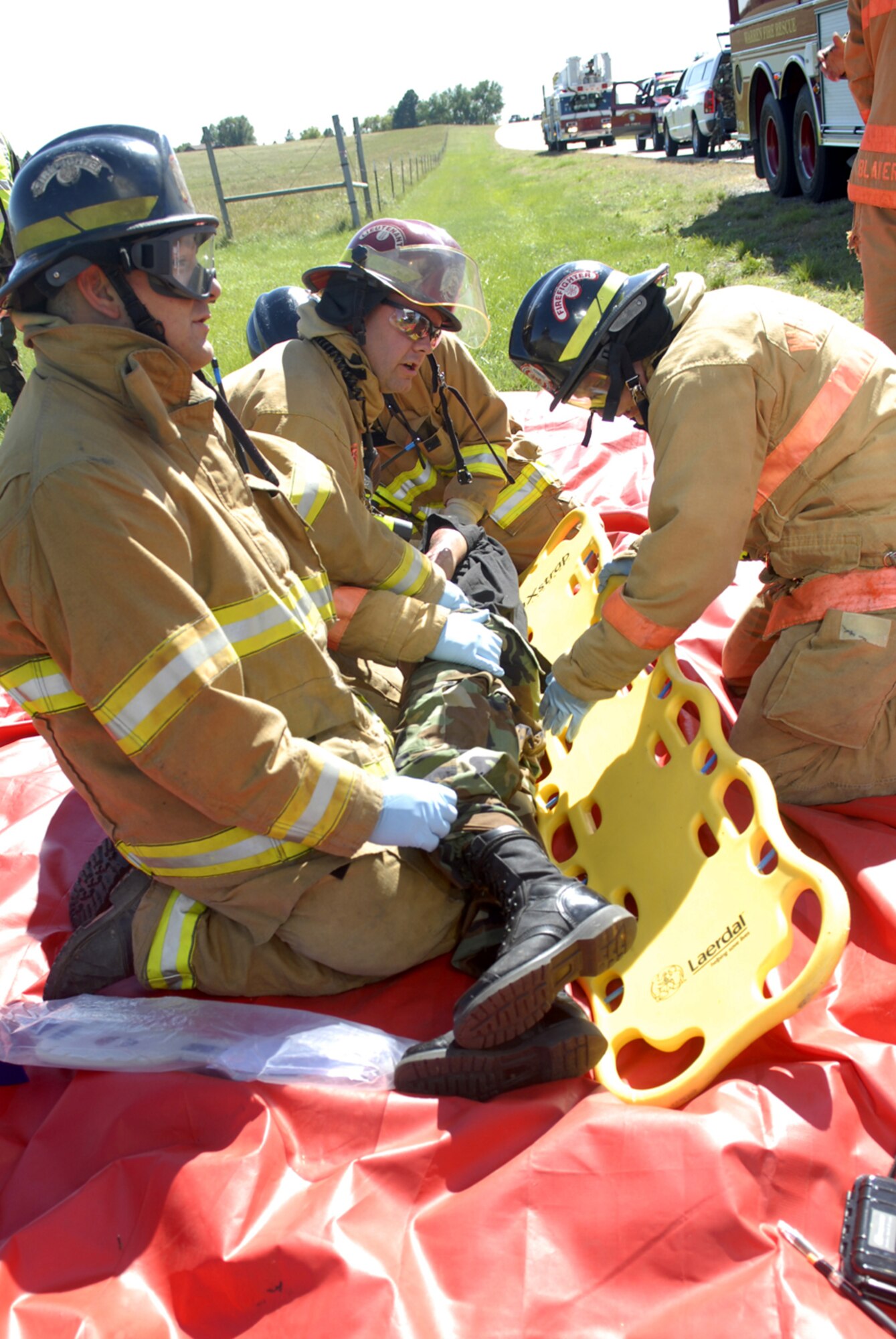 Warren firefighters provide patient care at the operation readiness inspection emergency management exercise involving a derailed train car that was carrying anhydrous ammonia Sept. 13. A nuclear surety inspection and an operational readiness inspection occurred at Warren back-to-back in September. The multi-week inspection tested the wing’s ability to safely handle, protect and transport critical components associated with the Minuteman III missile system and capabilities to go to war (Courtesy photo).