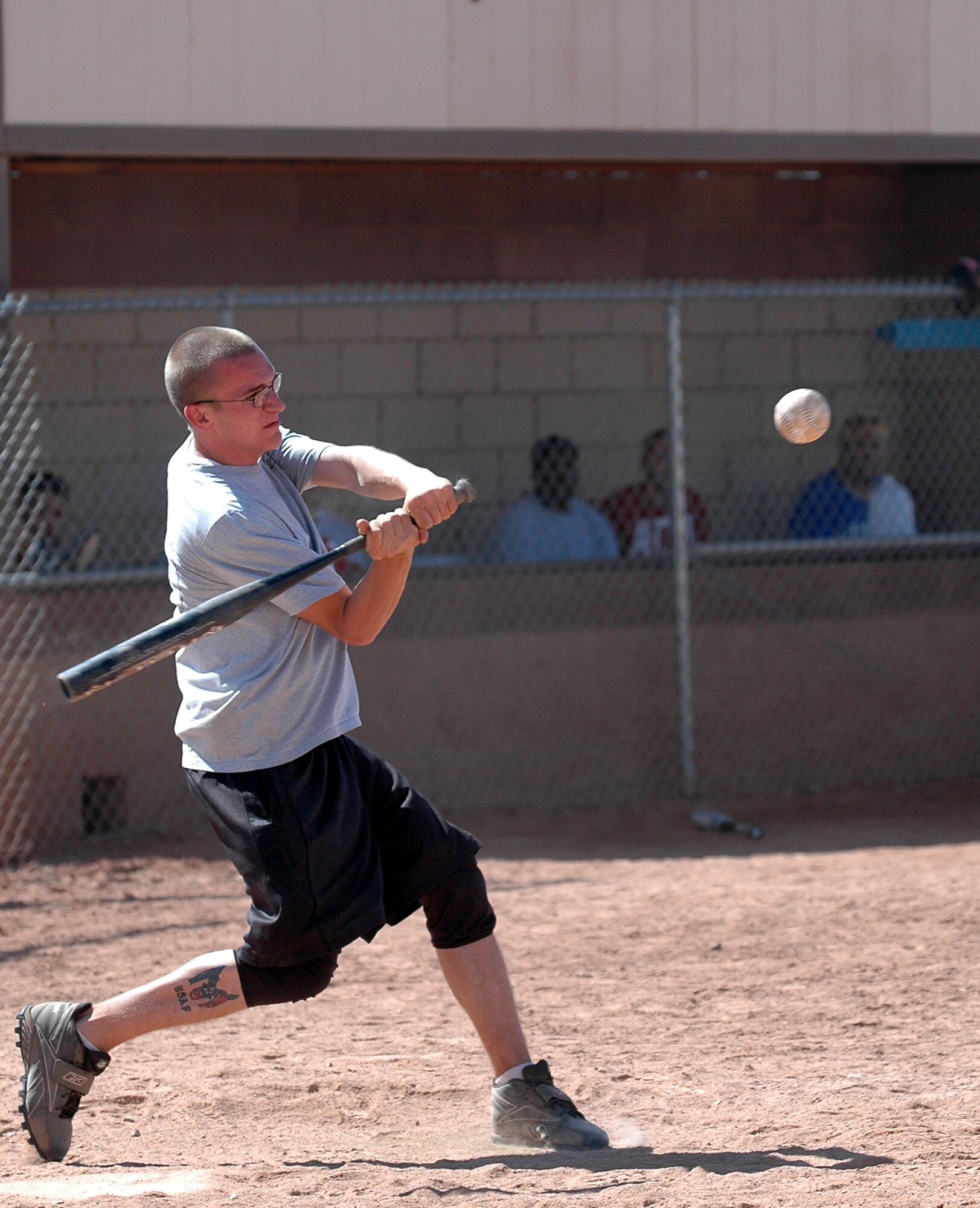 An Airmen from the 49th Operations Support Squadron hits the ball during the 49th Aircraft Maintenance Squadron and 49 OSS softball game Sept. 26 for Sports Day. 49 AMXS beat 49 OSS 10-9. (U.S. Air Force photo/Airman 1st Class Heather Stanton) 