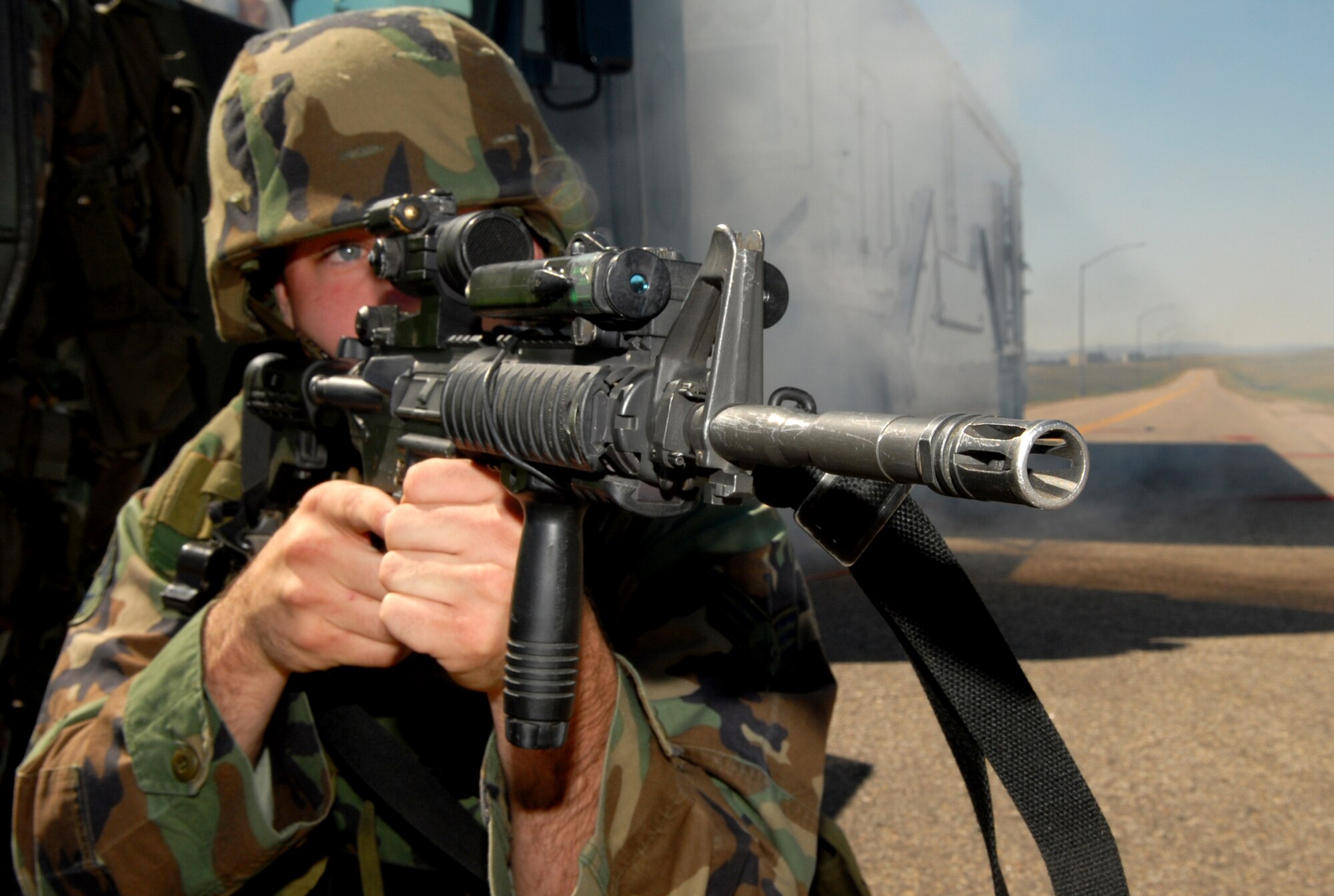 Senior Airman Richard Phillips, 790th Missile Security Forces Squadron, provides security for a payload transporter during simulated hostile acts during the nuclear surety inspection as part of a convoy response force. The Warren NSI took place in early September (Courtesy photo).