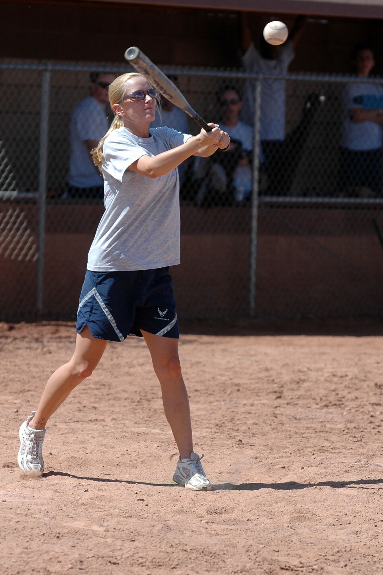 An Airmen from the 49th Operations Support Squadron hits the ball during the 49th Aircraft Maintenance Squadron and 49 OSS softball game Sept. 26 for Sports Day. 49 AMXS beat 49 OSS 10-9. (U.S. Air Force photo/Airman 1st Class Heather Stanton)