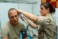 Senior Airman Elle Liza Marie Franz conducts a vital check on Army patient Sgt. Scott Boomershire at the Contingency Aeromedical Staging Facility Sept. 24 in Southwest Asia. The CASF is a 24-hour medical holding and staging facility, which averages about 300 patients per month. Airman Franz is a 386th Expeditionary Medical Group medical technician. (U.S. Air Force photo/Staff Sgt. Tia Schroeder)
