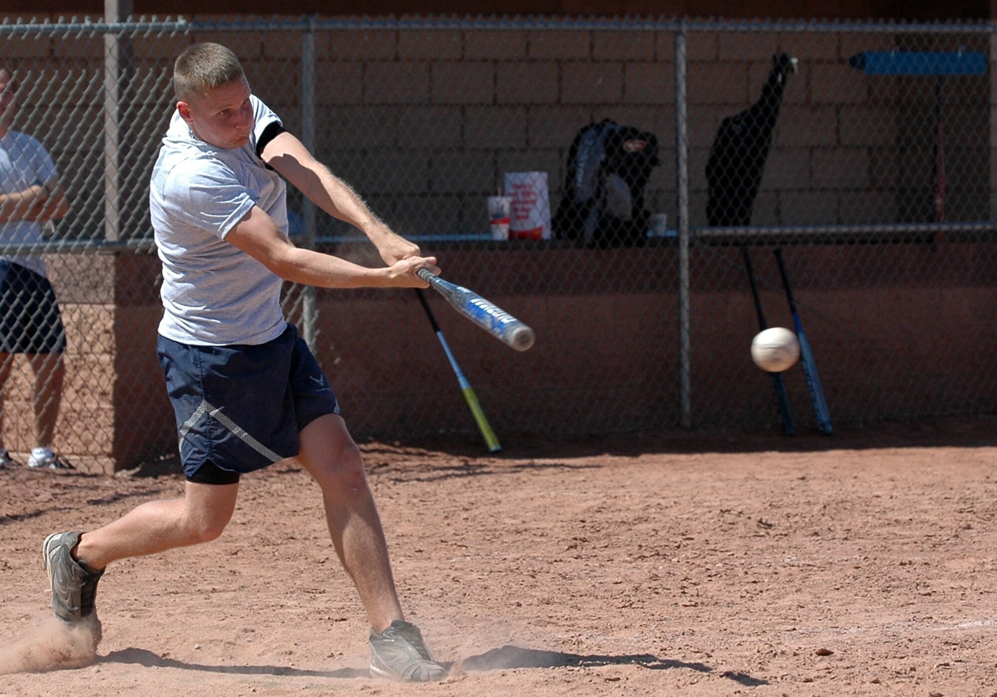 Airman 1st Class Bradley Barnes, 49th Fighter Wing Safety, belts the ball during the 49th Aircraft Maintenance Squadron and 49th Operations Support Squadron softball game Sept. 26 for Sports Day. Barnes helped 49 AMXS skid past 49 OSS 10-9. (U.S. Air Force photo/Airman 1st Class Heather Stanton)