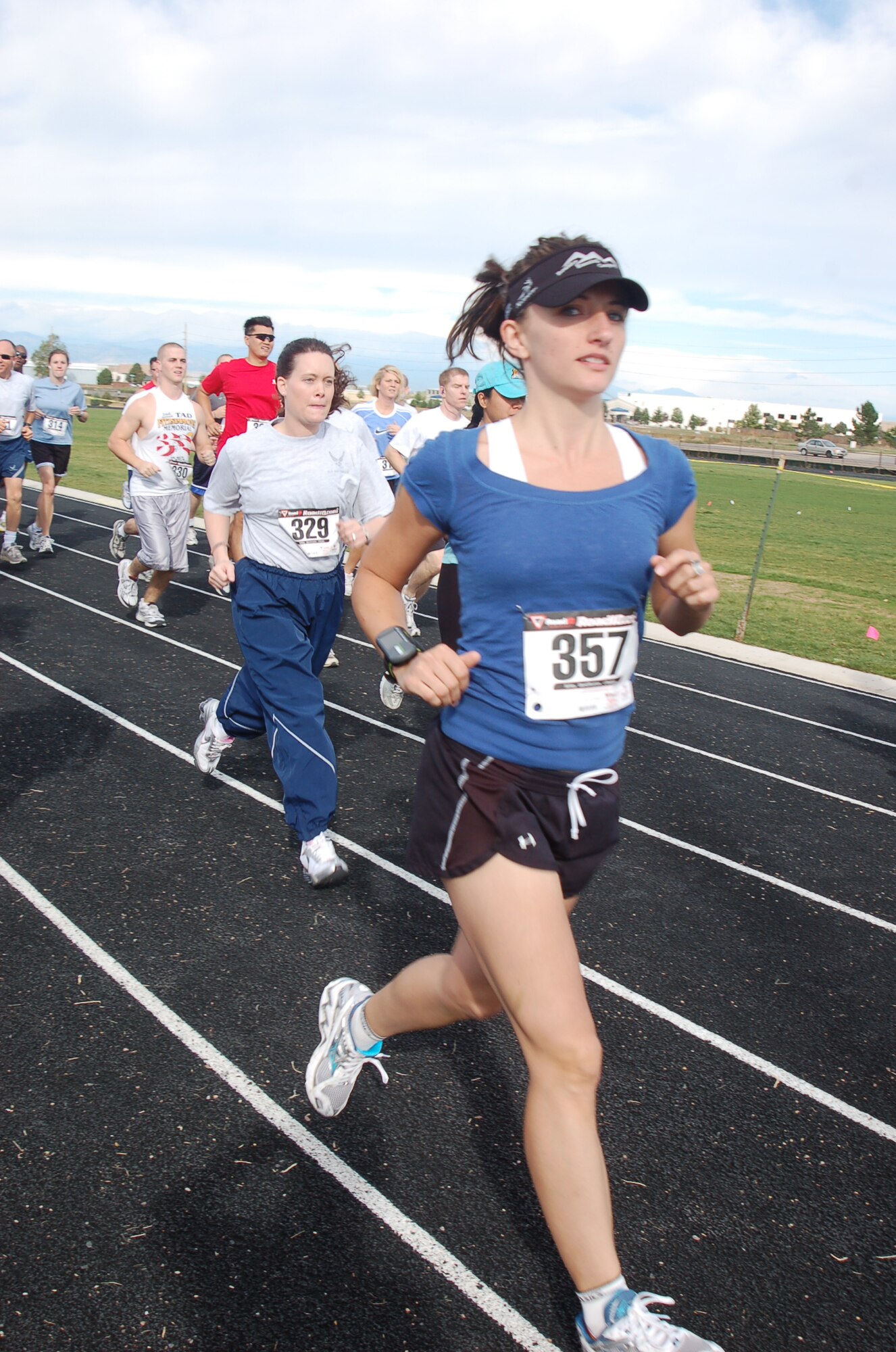 BUCKLEY AIR FORCE BASE, Colo. -- Kristin Adkins, a military spouse, runs in Buckley's 10k Panther Challenge Sept. 29. The Panther Challenge raised $1,388 donations for Hearts Across the Miles as well as large amounts of goods for care packages to send to deployed troops. 1st Lt. Tara Mercado won the Challenge in the women's division with a time of 48:42. (U.S. Air Force photo by Senior Airman Jacque Lickteig)