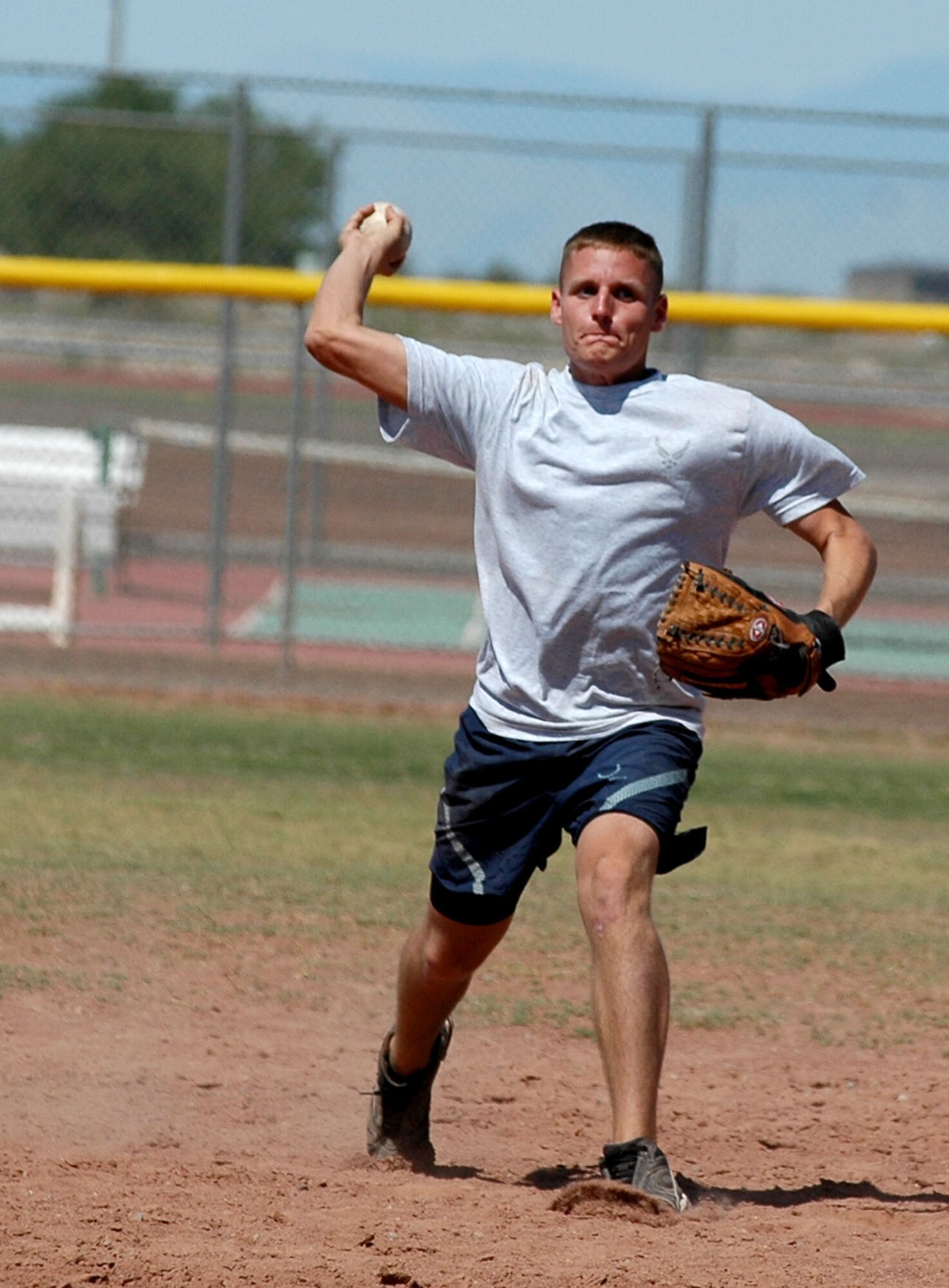 Airman 1st Class Bradley Barnes, 49th Fighter Wing Safety, threw a player out at first from shortstop to help the 49th Aircraft Maintenance Squadron win over the 49th Operations Support Squadron 10-9 during a one-pitch softball tournament Sept. 26 for Sports Day. (U.S. Air Force photo/Airman 1st Class Heather Stanton)