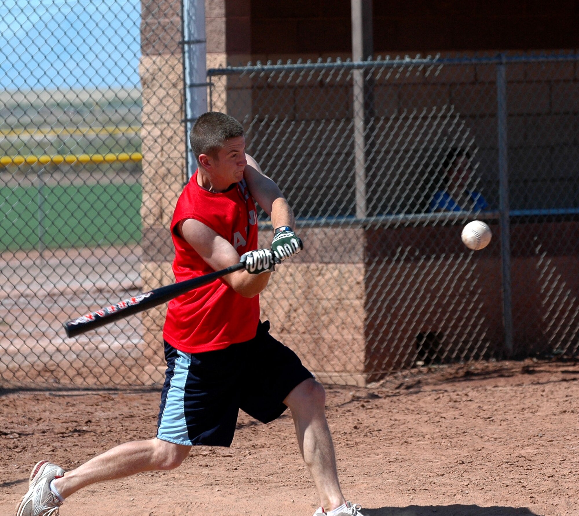 Airman 1st Class Tony Bovay, 49th Maintenance Squadron ammunitions flight, smashes the ball during a softball game. The 49th Logistics Readiness Squadron slid passed the Ammunitions flight 12-11 during the Sports Day one-pitch softball tournament Sept. 26. (U.S. Air Force photo/Airman 1st Class Heather Stanton)