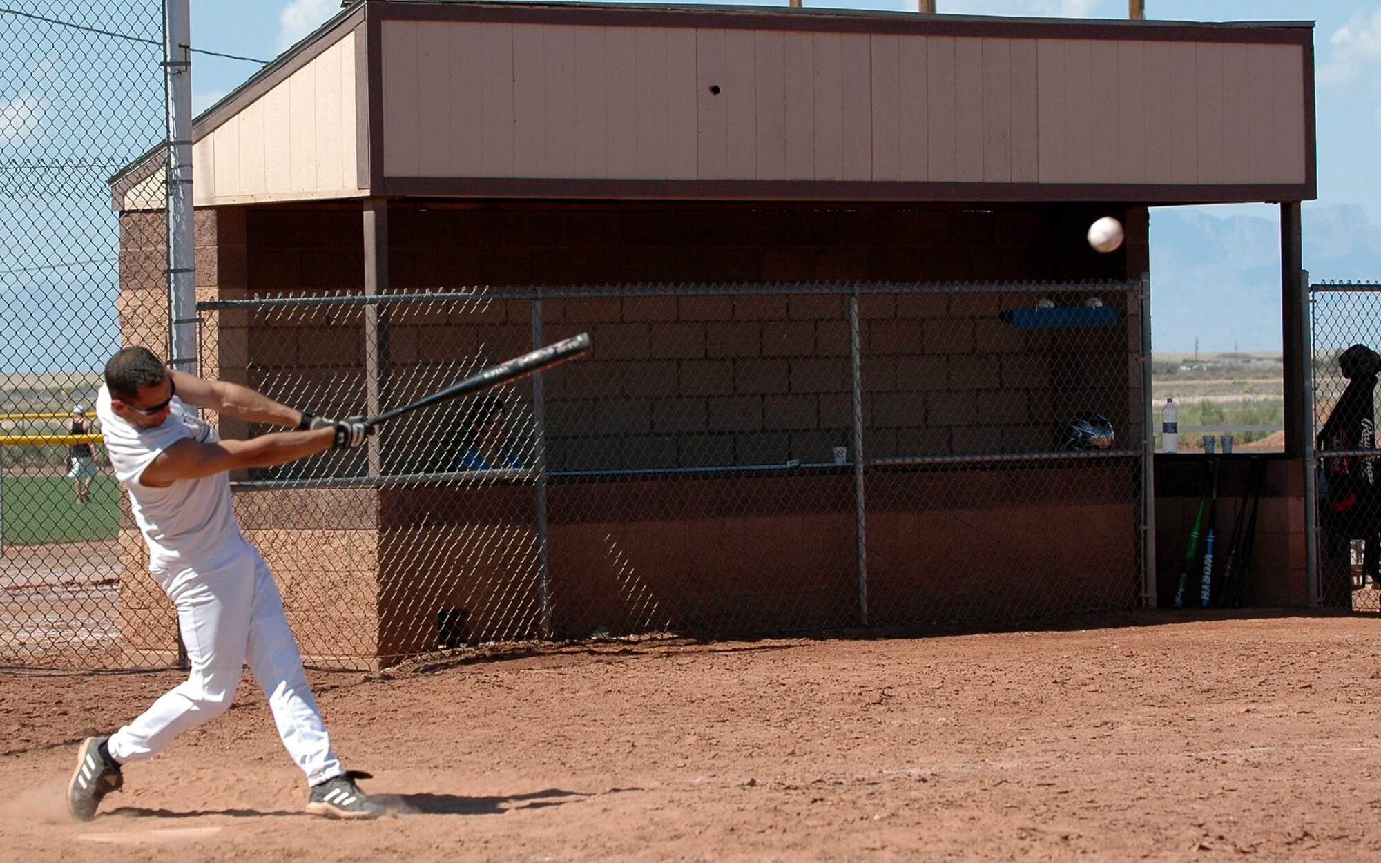 The 49th Logistics Readiness Squadron slid passed the Ammunitions flight 12-11 during the Sports Day one-pitch softball tournament Sept. 26. (U.S. Air Force photo/Airman 1st Class Heather Stanton)