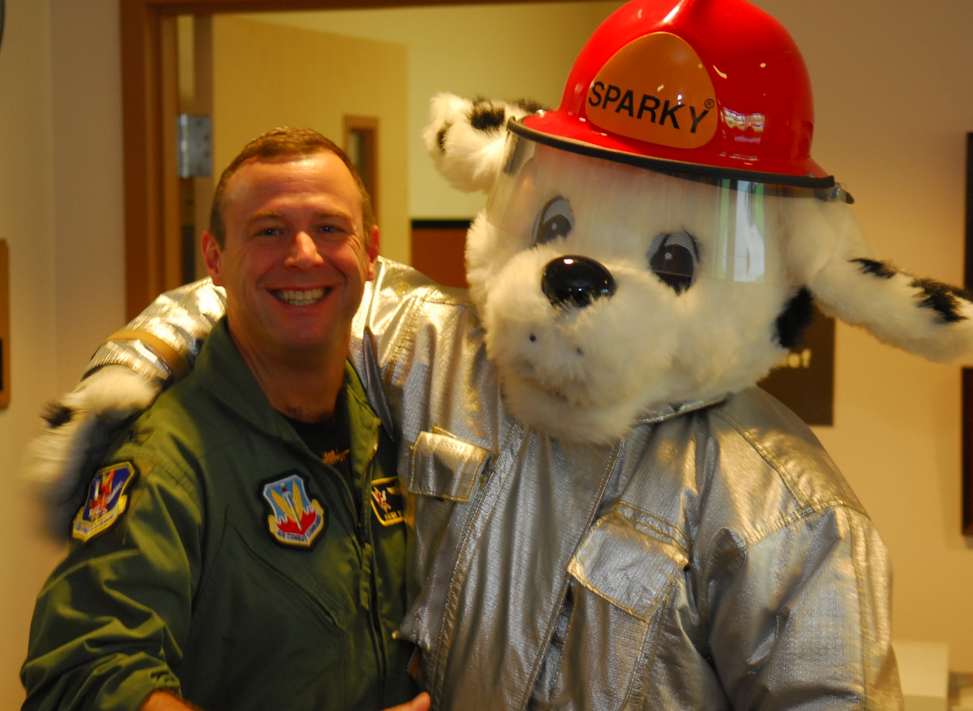 Col. Henry Santicola, 23rd Wing vice commander, greets Sparky the fire dog at the Moody Fire Department Sept. 28.  The 23rd Civil Engineer Squadron Fire and Emergency Services flight is kicking off fire safety week Oct. 7-13. This year’s theme is “Practice your escape plan.” The fire station will host an open house at 1 p.m. Oct. 12 (U.S. Air Force photo by Tech. Sgt. Parker Gyokeres)
