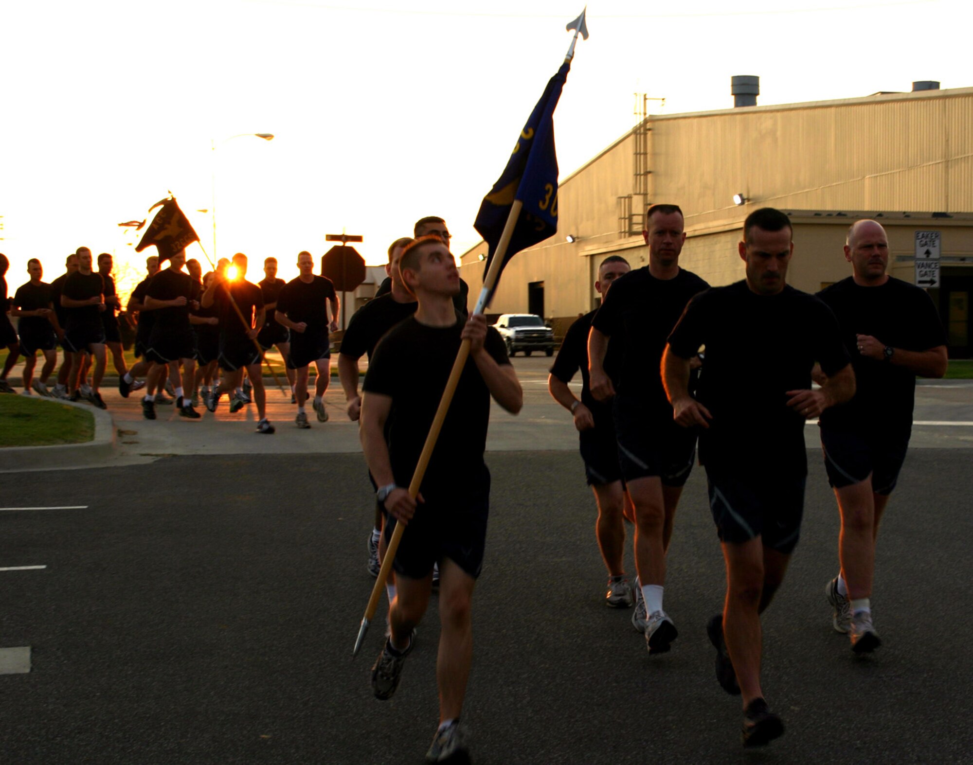 Airmen begin their 5K run as the sun rises on the second annual Prisoner of War/Missing In Action Memorial Run Sept. 28.  About 1,500 Airmen across Tinker participated in the event, which began at the POW/MIA memorial in the Tinker Air Park, wound through the base and ended on the 72nd Air Base Wing headquarters lawn.  (Photo by Staff Sgt. Stacy Fowler)