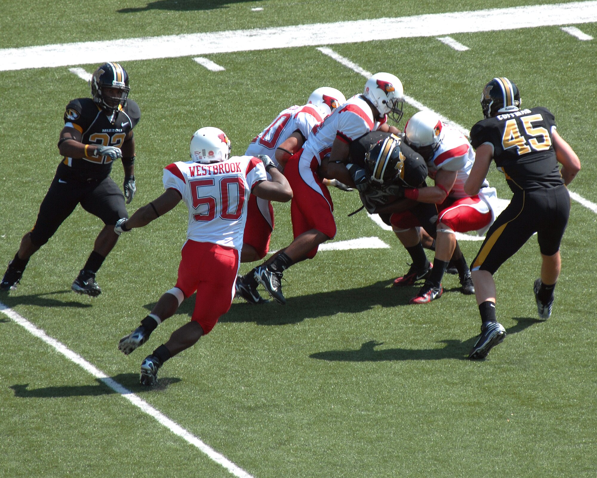 COLUMBIA, Mo. – Tiger wide receiver Jason Ray takes three Illinois State tacklers with him during a non-conference contest Sept. 22. Ray caught one pass on the day for nine yards. (U.S. Air Force photo/Staff Sgt. Charles D. Larkin Sr.)  