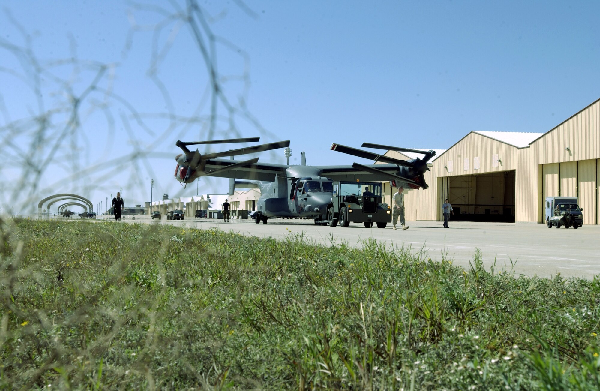 A tumbleweed frames a CV-22 Osprey being towed Sept. 25 at Cannon AFB, N.M. Cannon AFB will be transferred from Air Combat Command to Air Force Special Operations Command Oct. 1. CV-22s are among the special operations aircraft that will be assigned to the 27th Special Operations Wing which -- as the 27th Fighter Wing -- flew F-16 Fighting Falcons at the base from 1995 to 2007. (U.S. Air Force photo/Greg Allen) 
