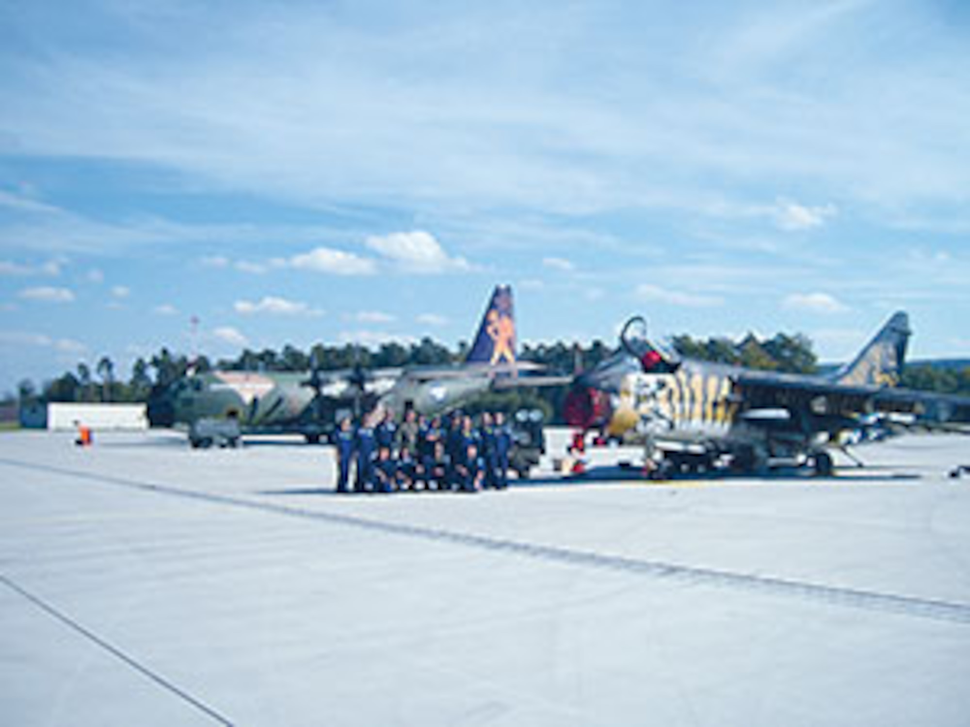 Ramstein Airmen with members of the Greek Maintenance Recovery Team Sept. 22 after towing and repairing a Greek A-7E, which while taxiing down Ramstein's flight line, had a tire blow out, sending it off the runway. Ramstein Airmen worked through the night to get the flight line ready for incoming air traffic.
